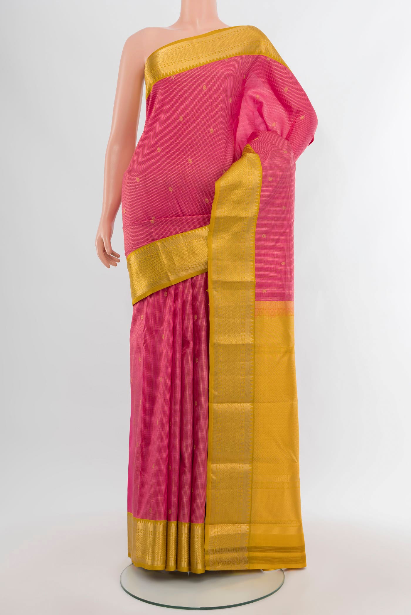 Pink Kanjivaram Silk Saree with Zari Butta on the body and Zari Border.  displayed on a mannequin