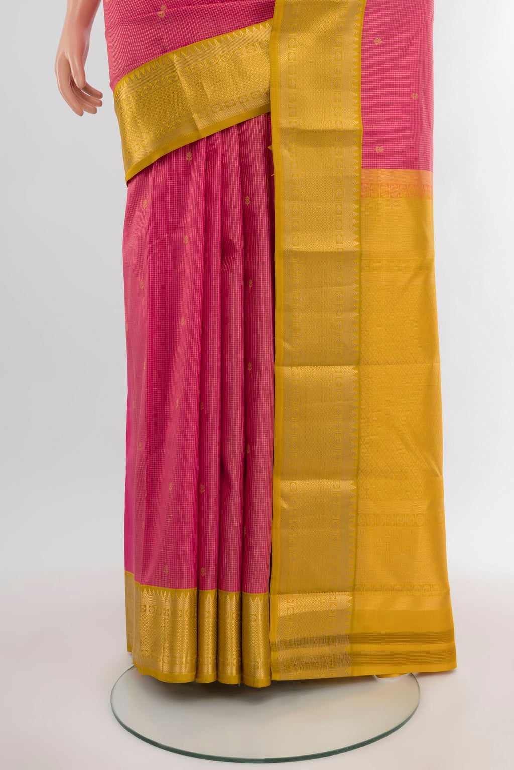 Pleats and pallu of Pink Kanjivaram Silk Saree with Zari Butta on the body and Zari Border. 