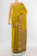 Mehandi Green Kanjivaram Silk Saree with Zari Butta on the body and Zari Border.  displayed on a mannequin