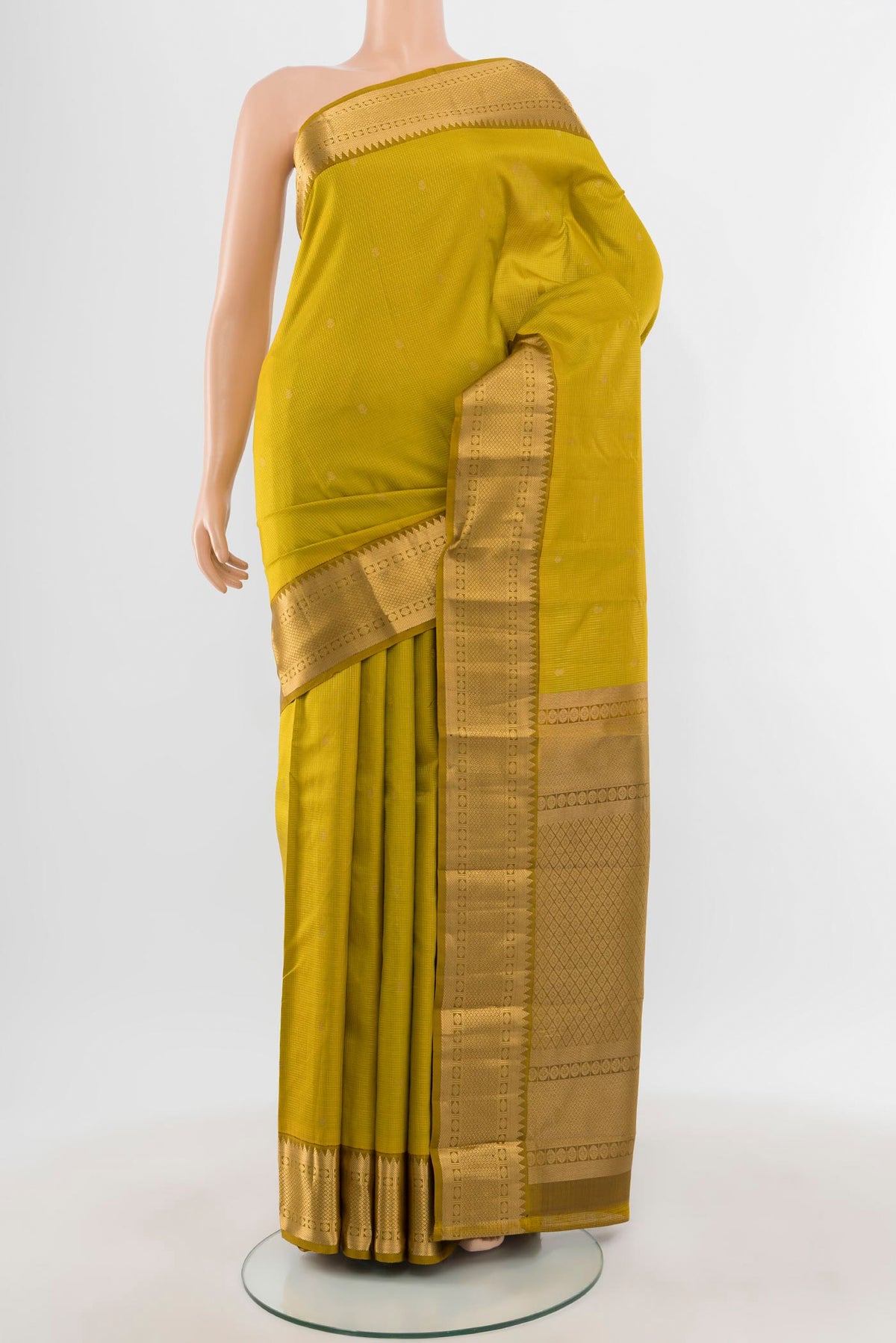 Mehandi Green Kanjivaram Silk Saree with Zari Butta on the body and Zari Border.  displayed on a mannequin