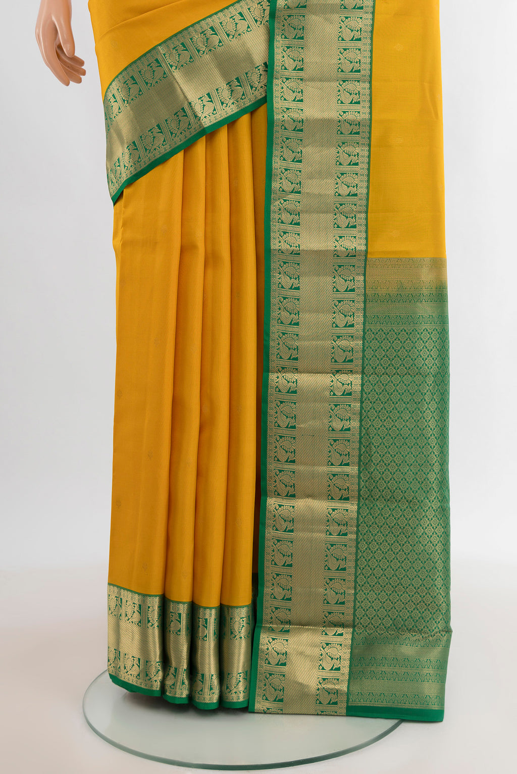 Pleats and pallu of Yellow Kanchipuram Silk Saree with Zari Butta on the body and Zari Border. 