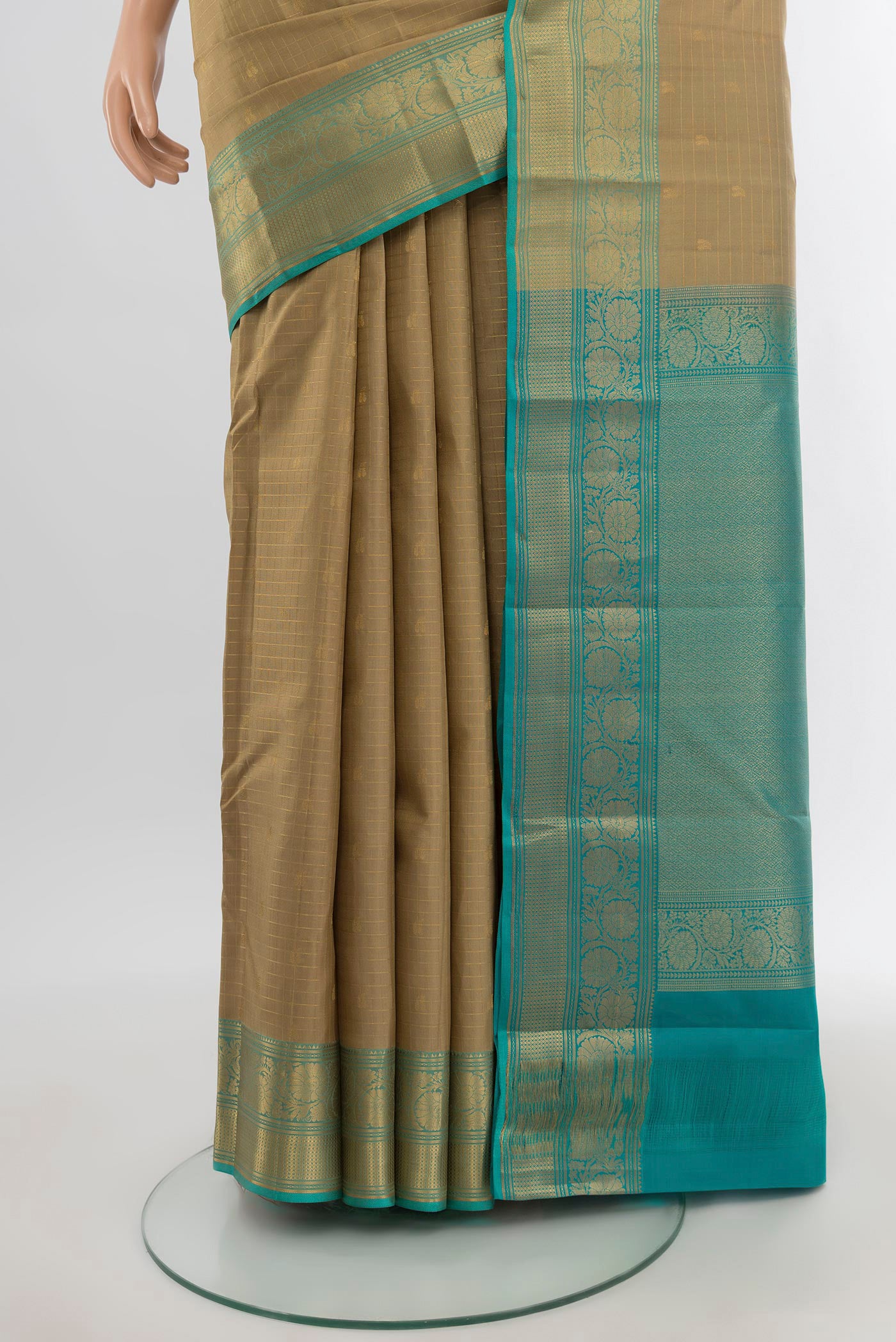 Pleats and pallu of Beige Kanchipuram Silk Saree with Checked design on the body and Zari Border. 