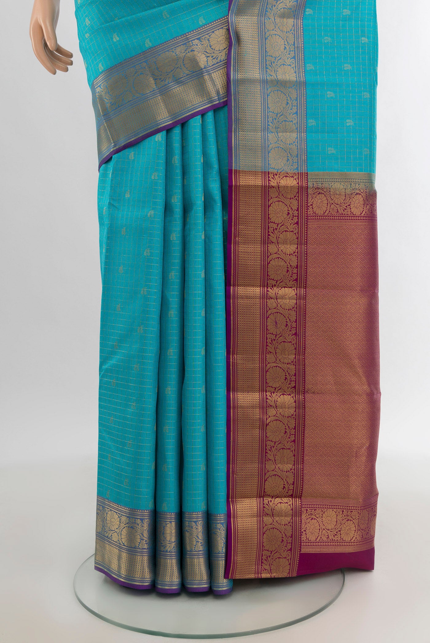 Pleats and pallu of Sky Blue Kanchipuram Silk Saree with Zari Butta on the body and Zari Border. 