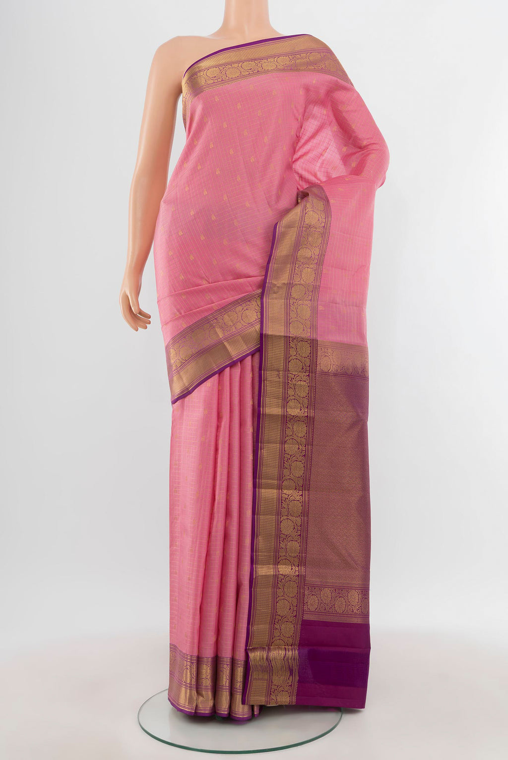 Rose pink Kanchipuram Silk Saree with Checked design on the body and Zari Border.  displayed on a mannequin