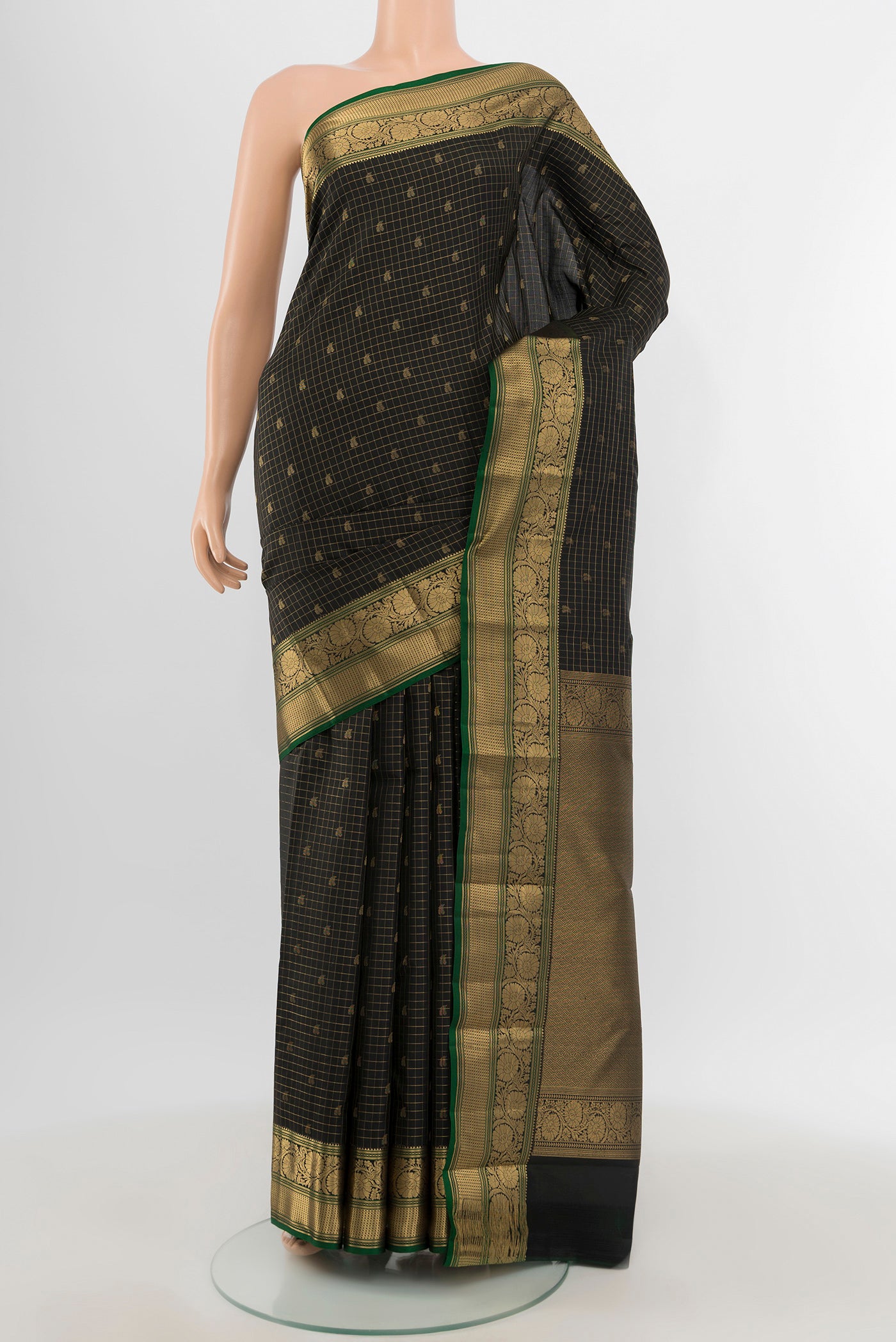 Black Kanchipuram Silk Saree with Checked design on the body and Zari Border.  displayed on a mannequin