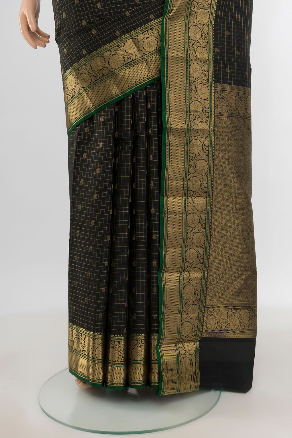 Pleats and pallu of Black Kanchipuram Silk Saree with Checked design on the body and Zari Border. 