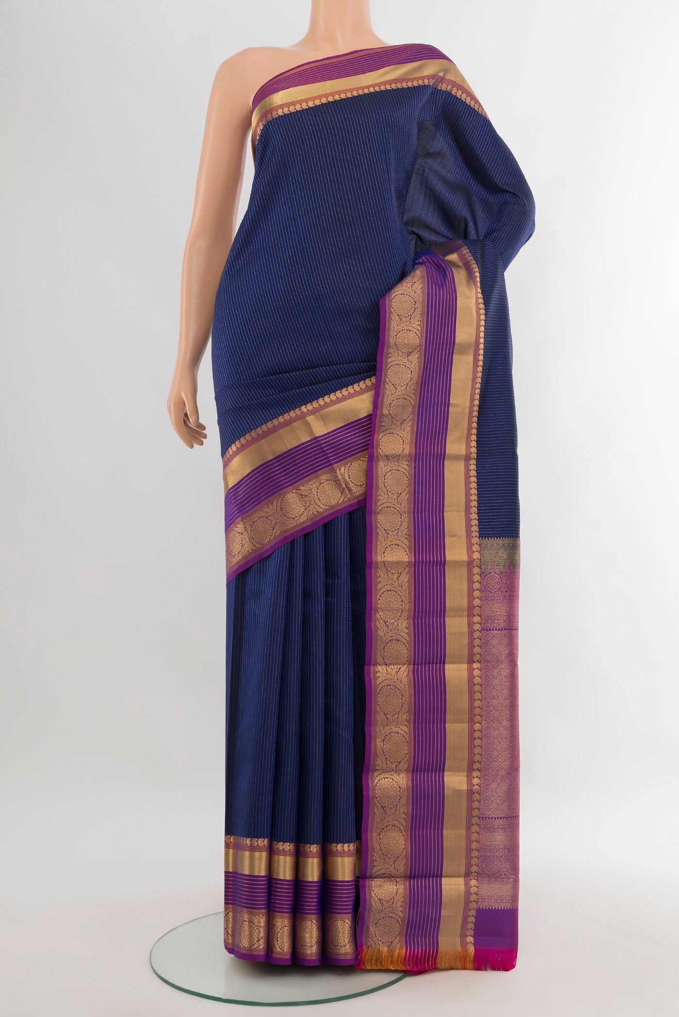 Dark Blue Kanjivaram Silk Saree with Stripes on the body and Zari Border.  displayed on a mannequin