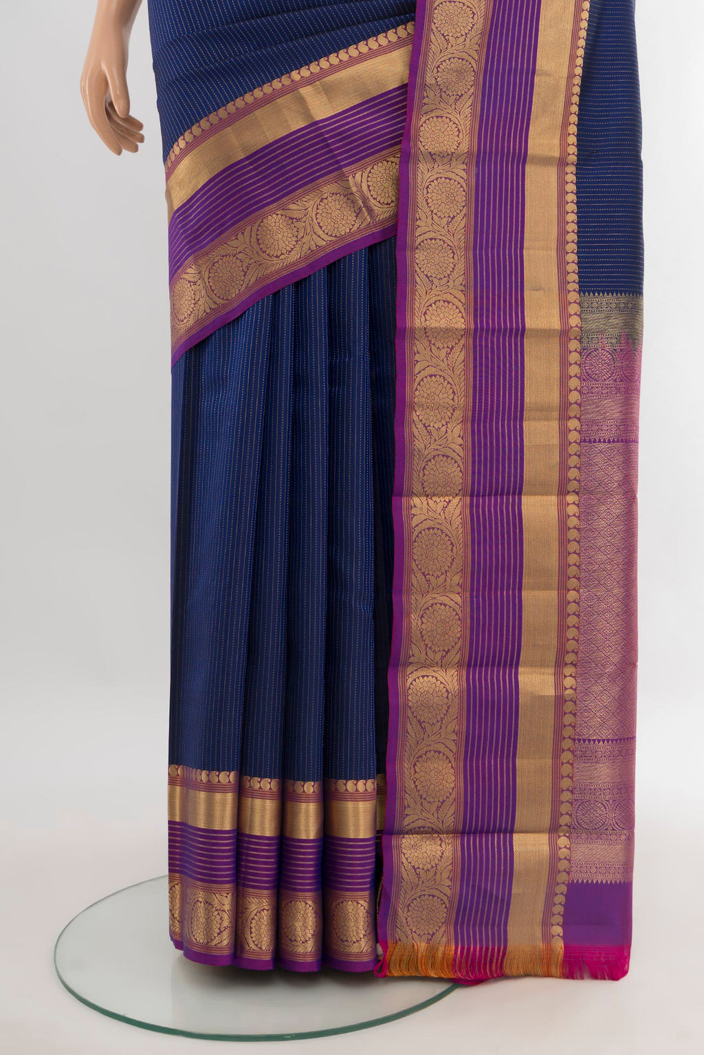 Pleats and pallu of Dark Blue Kanjivaram Silk Saree with Stripes on the body and Zari Border. 
