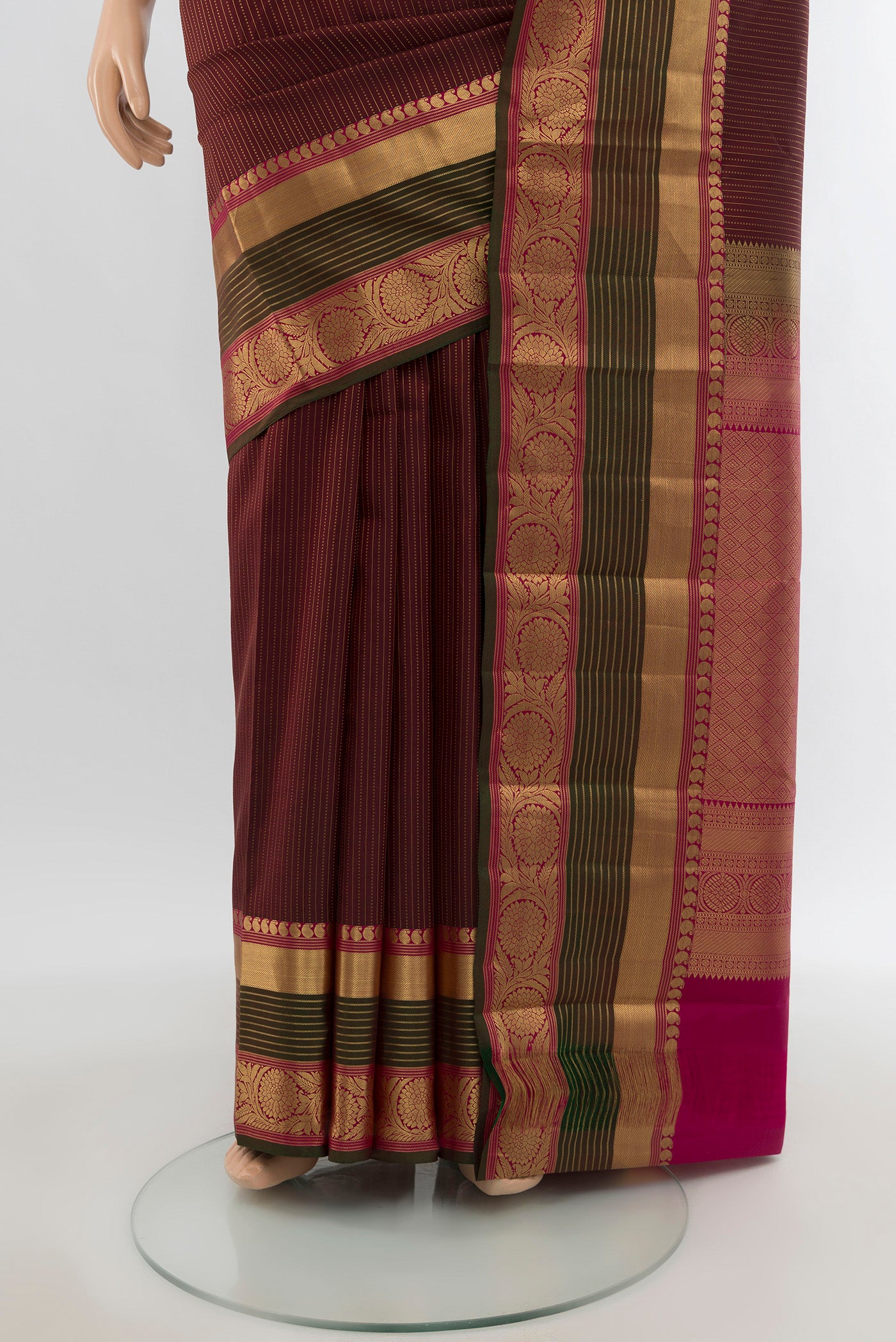 Pleats and pallu of Maroon Kanjivaram Silk Saree with Zari Butta on the body and Zari Border. 