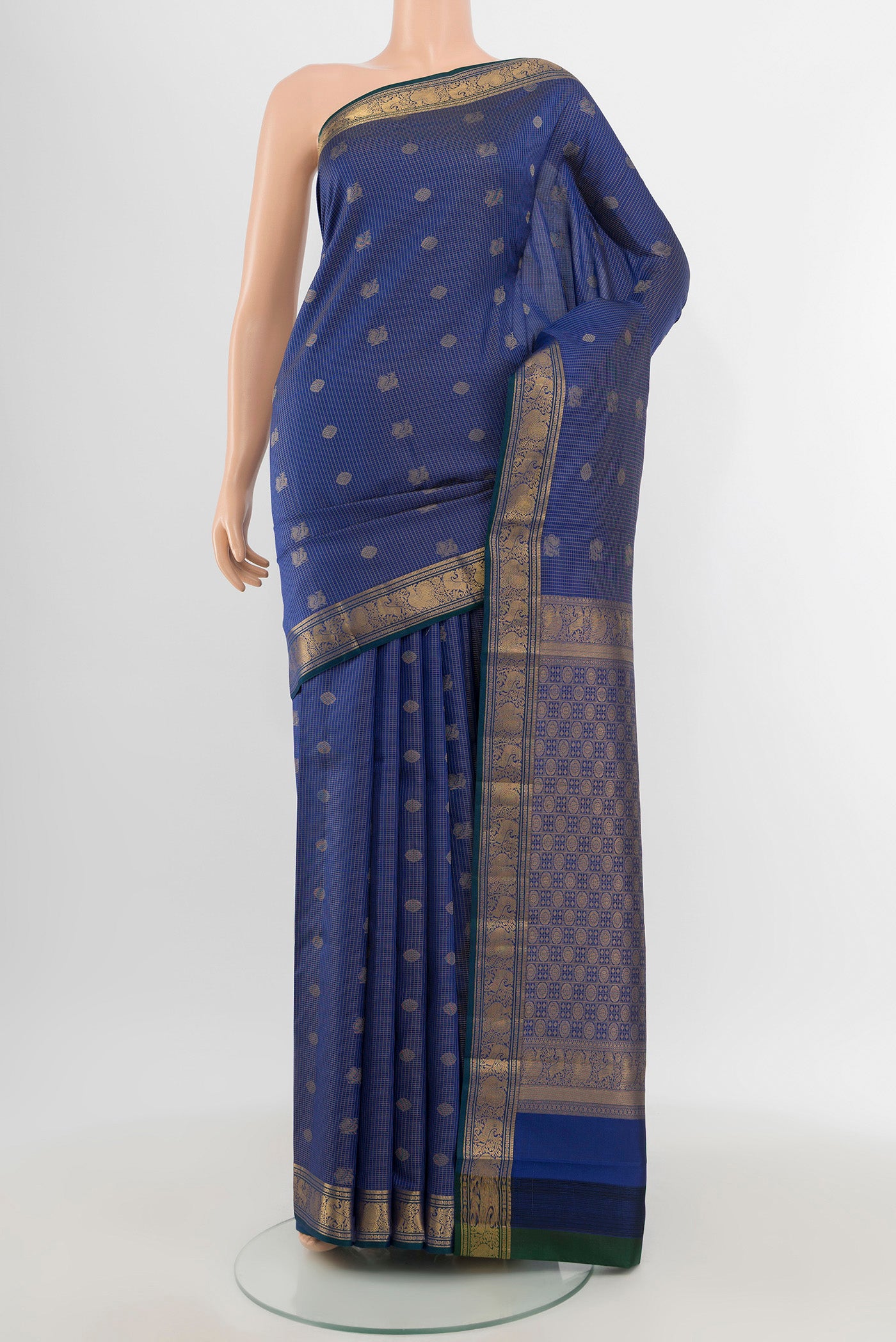 Blue Kanchipuram Silk Saree with Zari Butta on the body and Zari Border.  displayed on a mannequin
