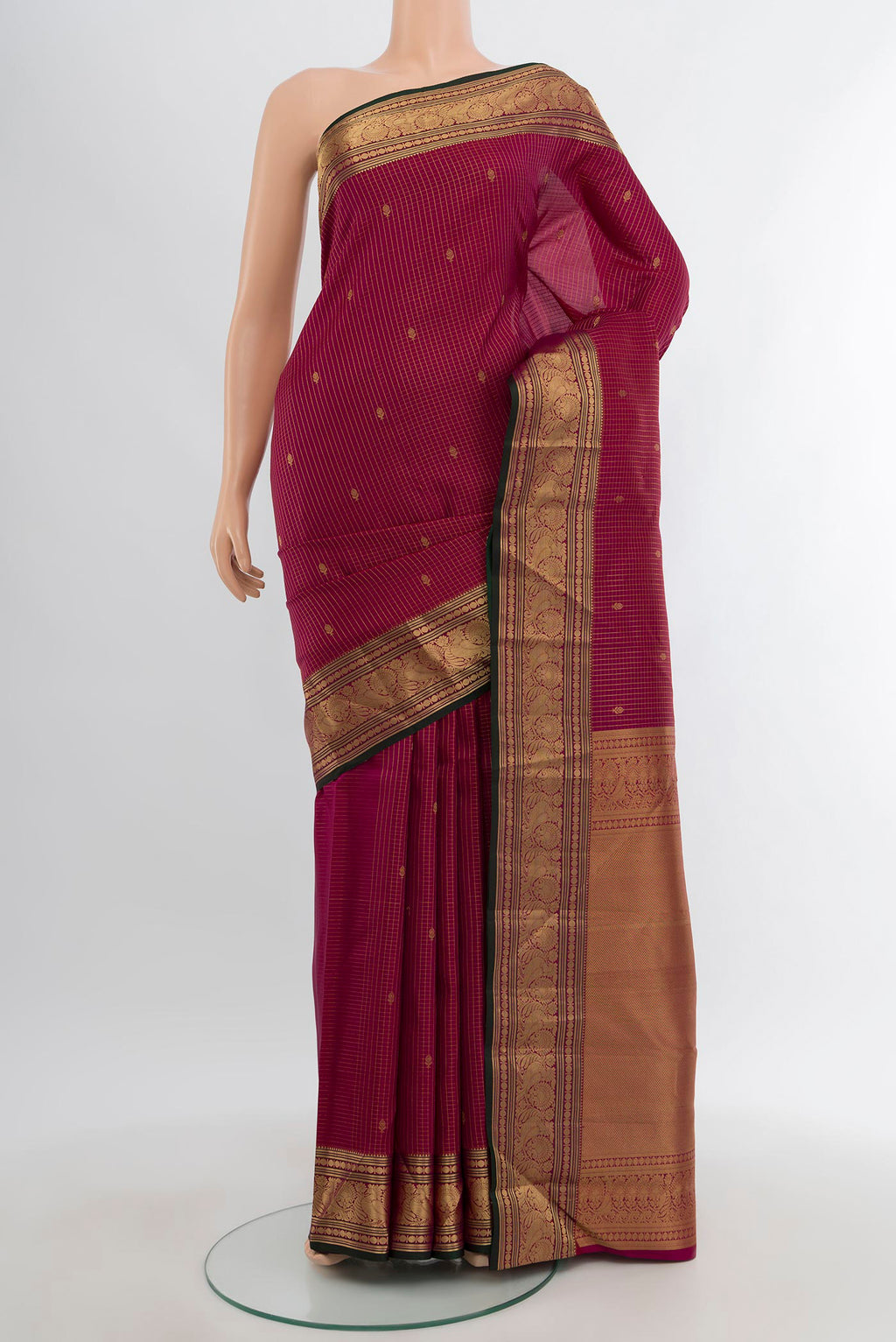 Magenta Kanchipuram Silk Saree with Zari Butta on the body and Zari Border.  displayed on a mannequin