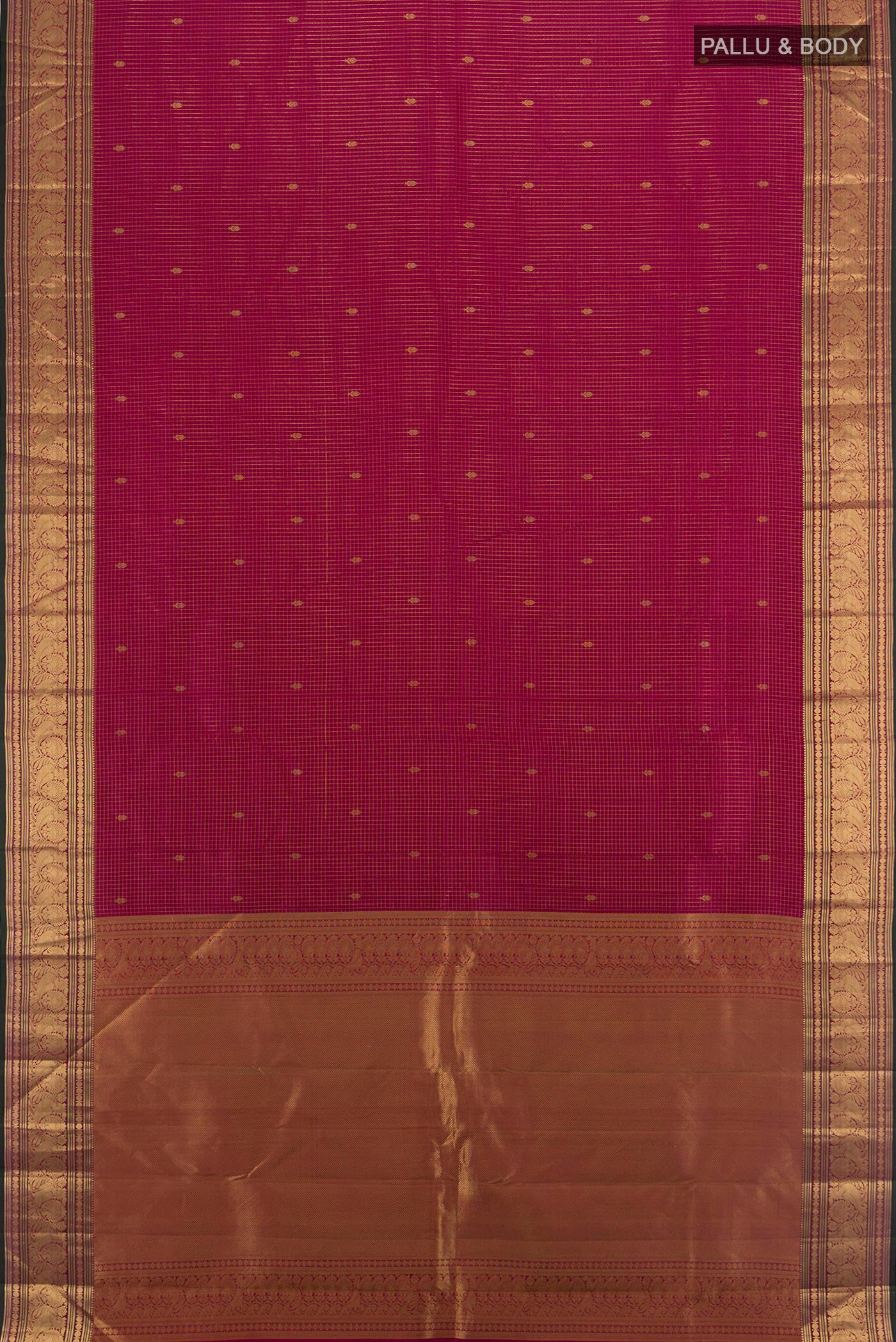 Flat view of Magenta Kanchipuram Silk Saree with Zari Butta on the body and Zari Border. 