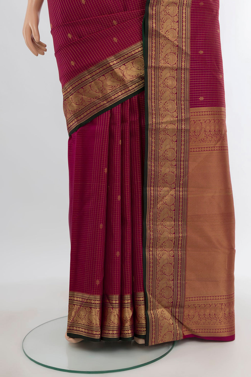 Pleats and pallu of Magenta Kanchipuram Silk Saree with Zari Butta on the body and Zari Border. 