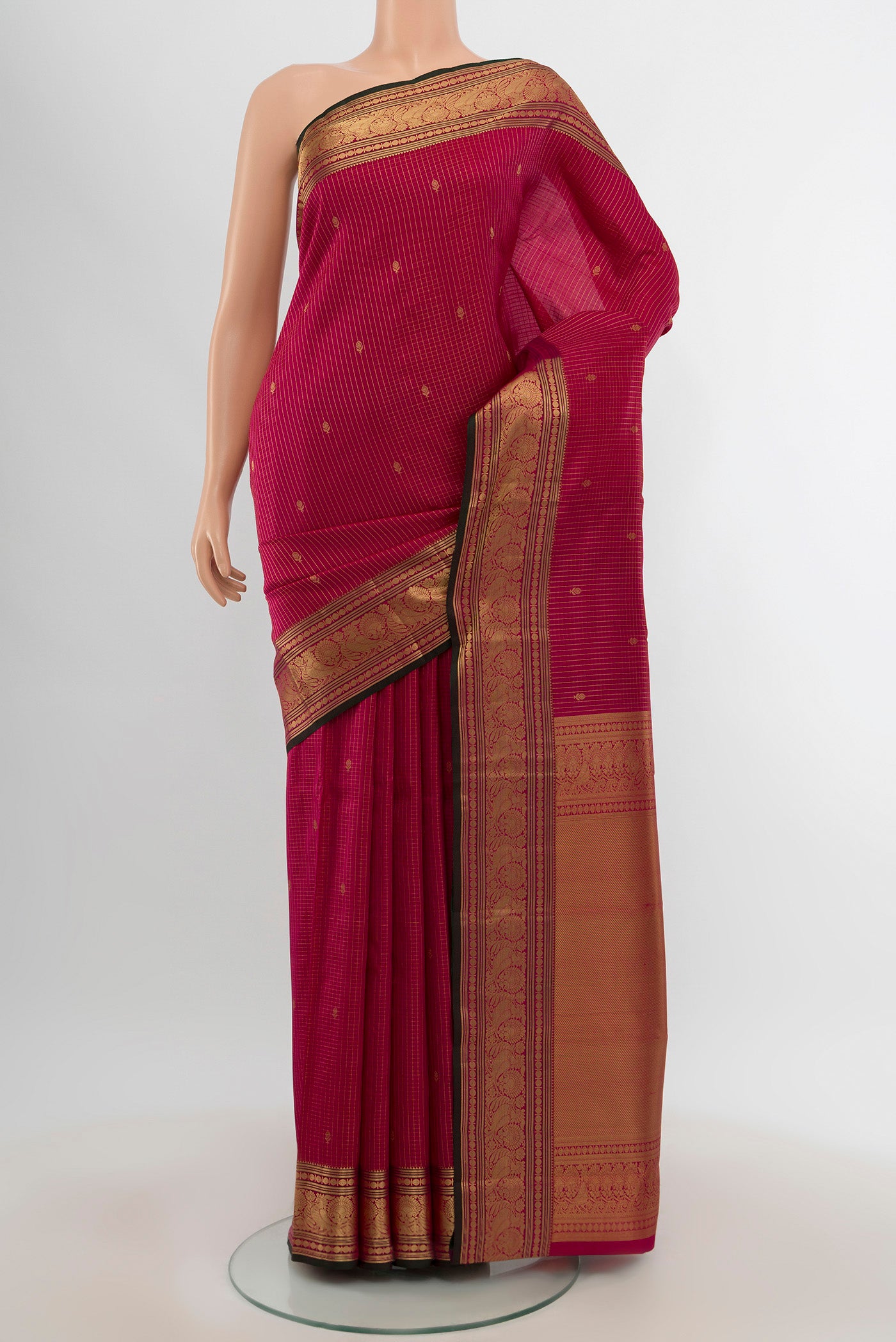 Dark Pink Kanchipuram Silk Saree with Zari Butta on the body and Zari Border.  displayed on a mannequin