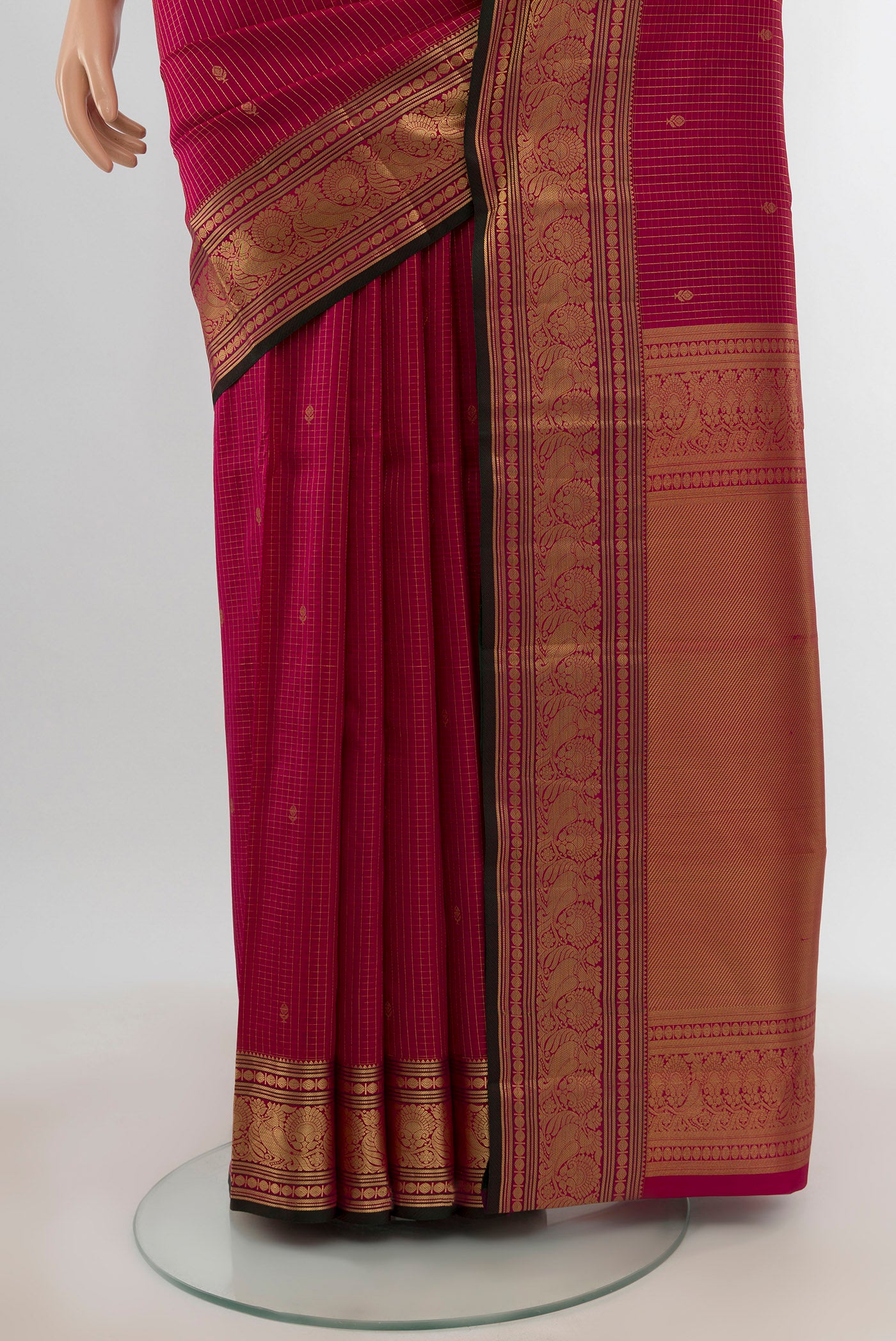 Pleats and pallu of Dark Pink Kanchipuram Silk Saree with Zari Butta on the body and Zari Border. 