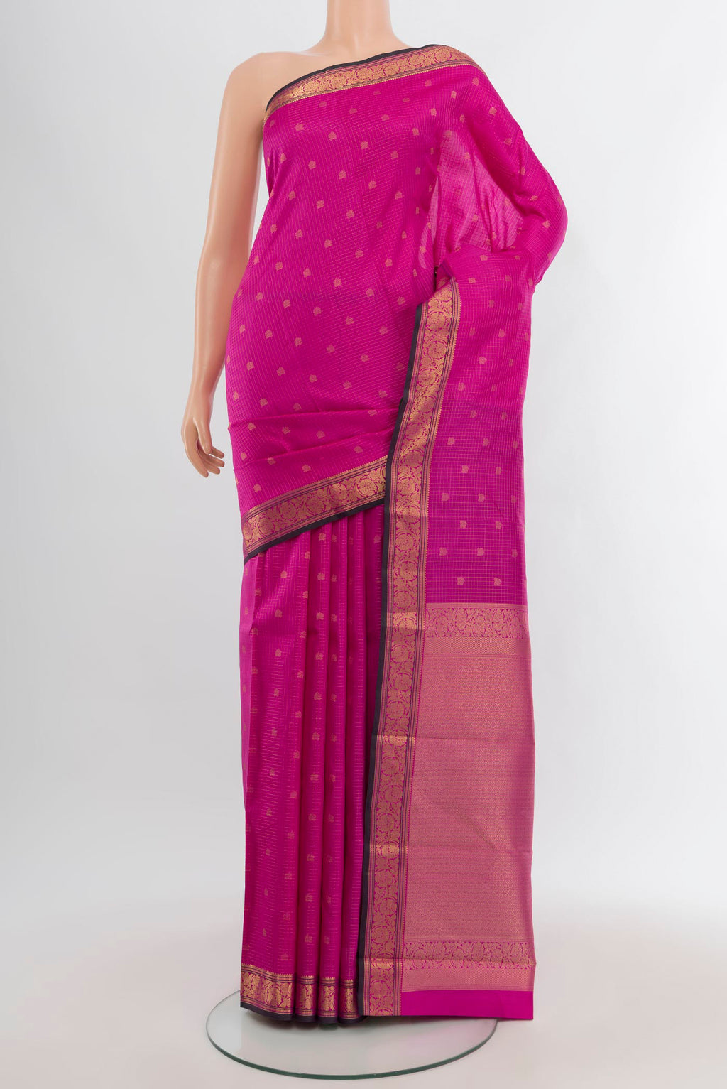 Rani Pink Kanchipuram Silk Saree with Zari Butta on the body and Zari Border.  displayed on a mannequin