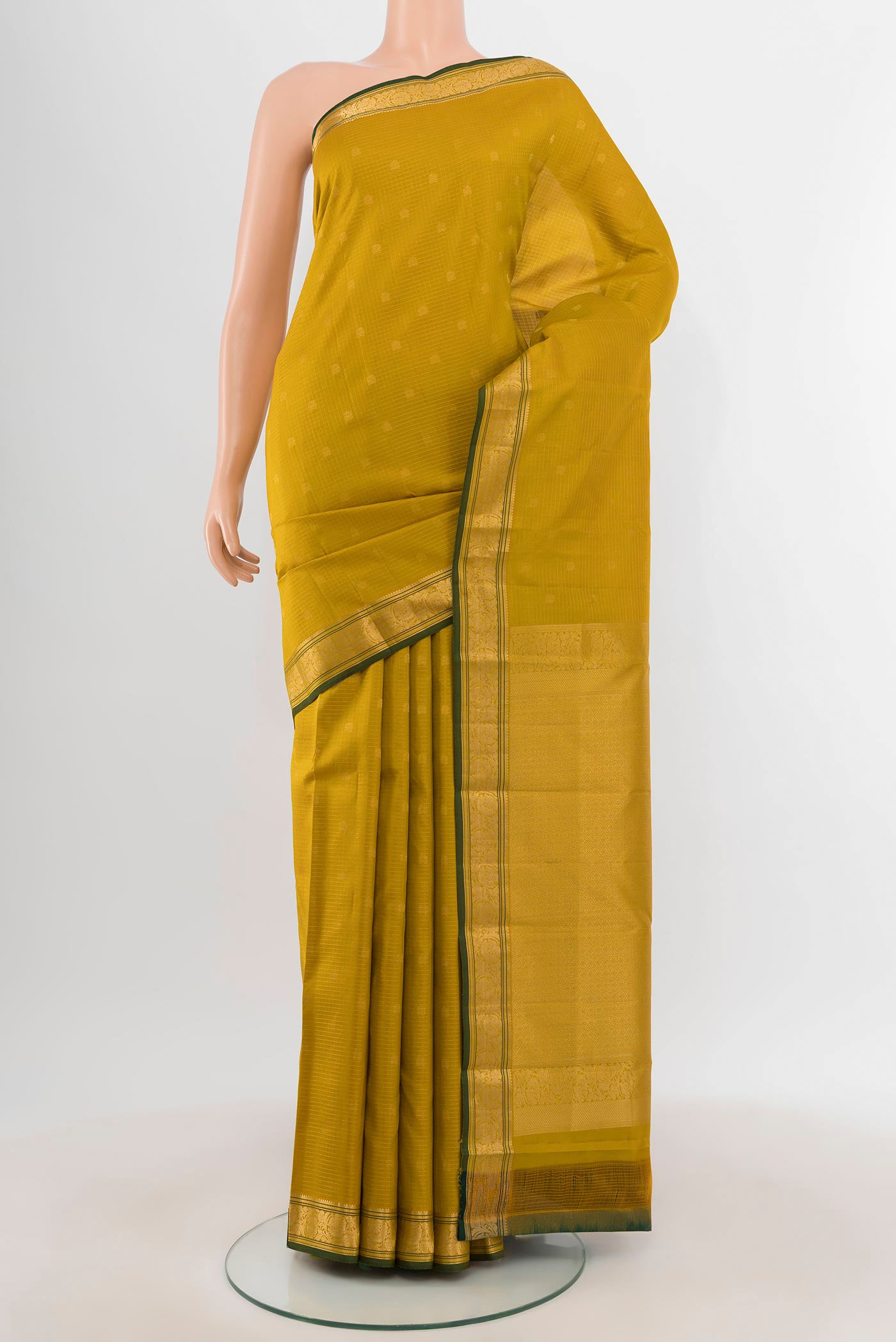 Mehandi Green Kanchipuram Silk Saree with Zari Butta on the body and Zari Border.  displayed on a mannequin