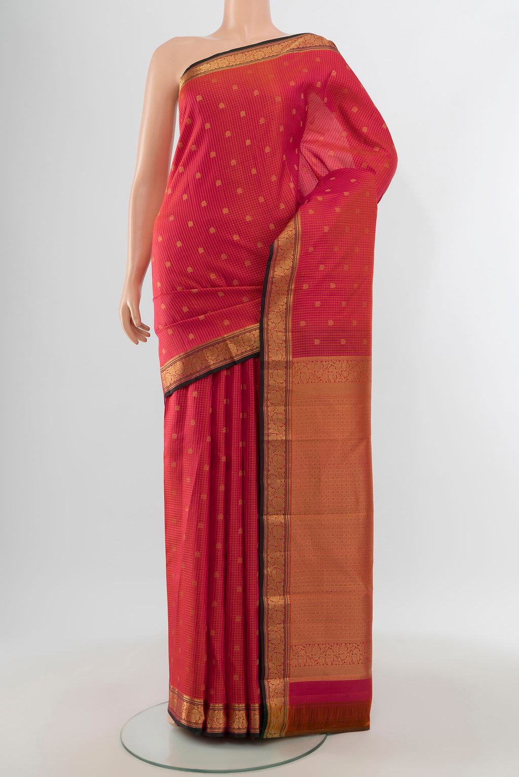 Pink Kanchipuram Silk Saree with Zari Butta on the body and Zari Border.  displayed on a mannequin