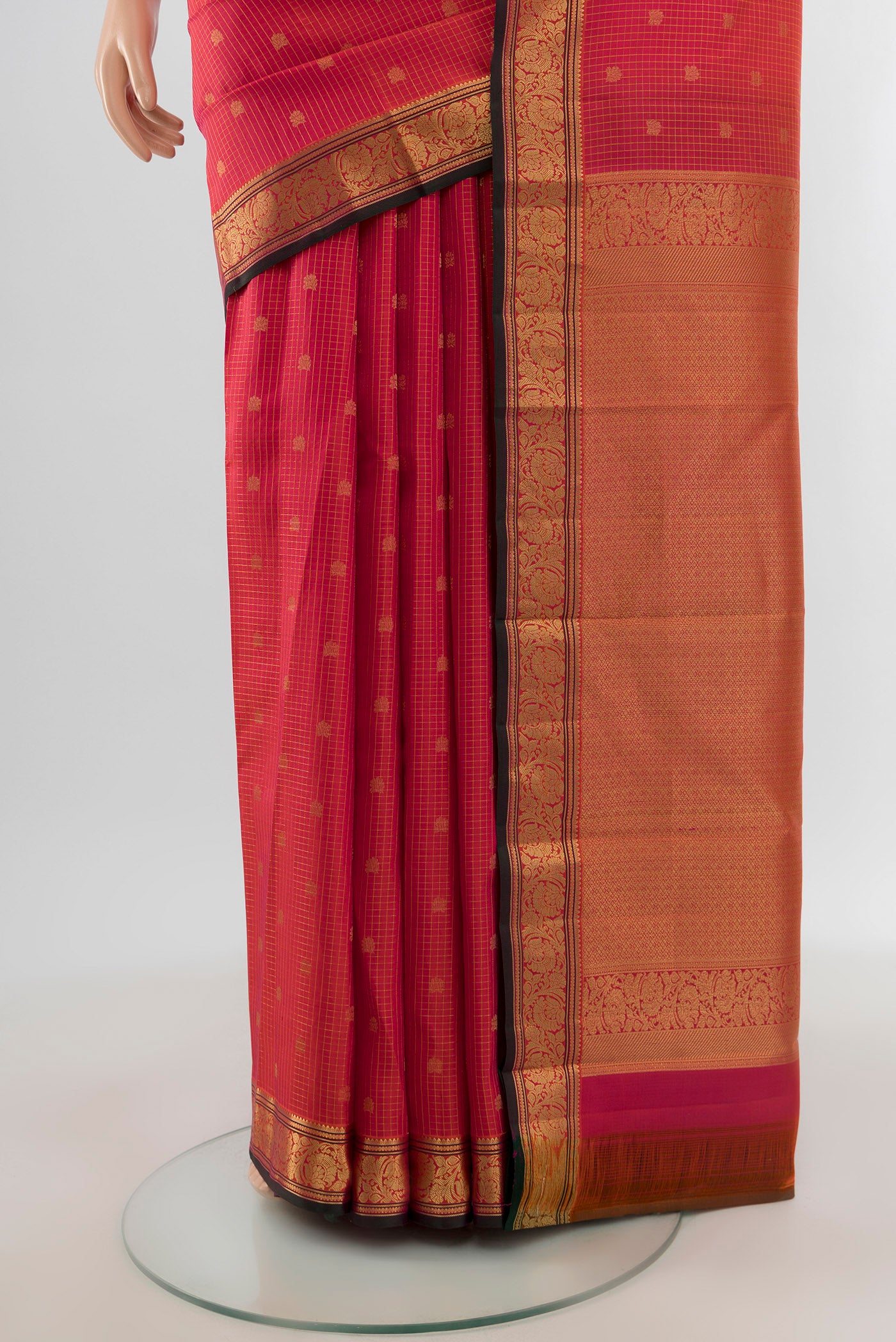 Pleats and pallu of Pink Kanchipuram Silk Saree with Zari Butta on the body and Zari Border. 