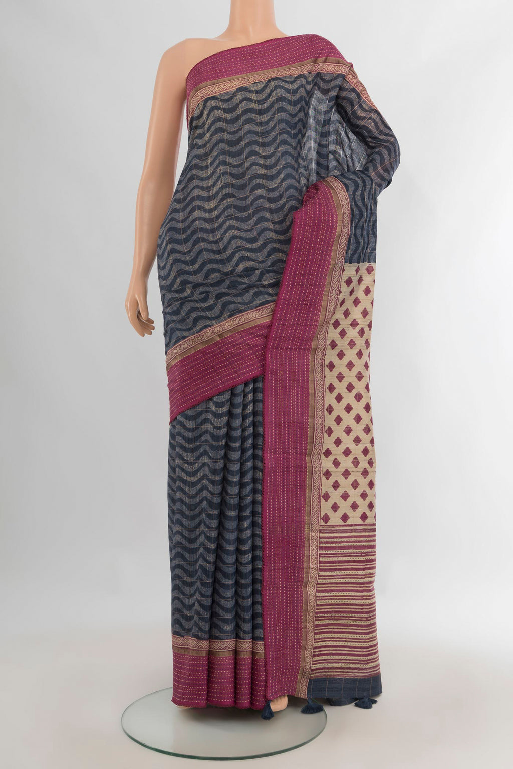 Pure Silk Blue Tussar Saree with Printed design on the body and Plain Border.  displayed on a mannequin