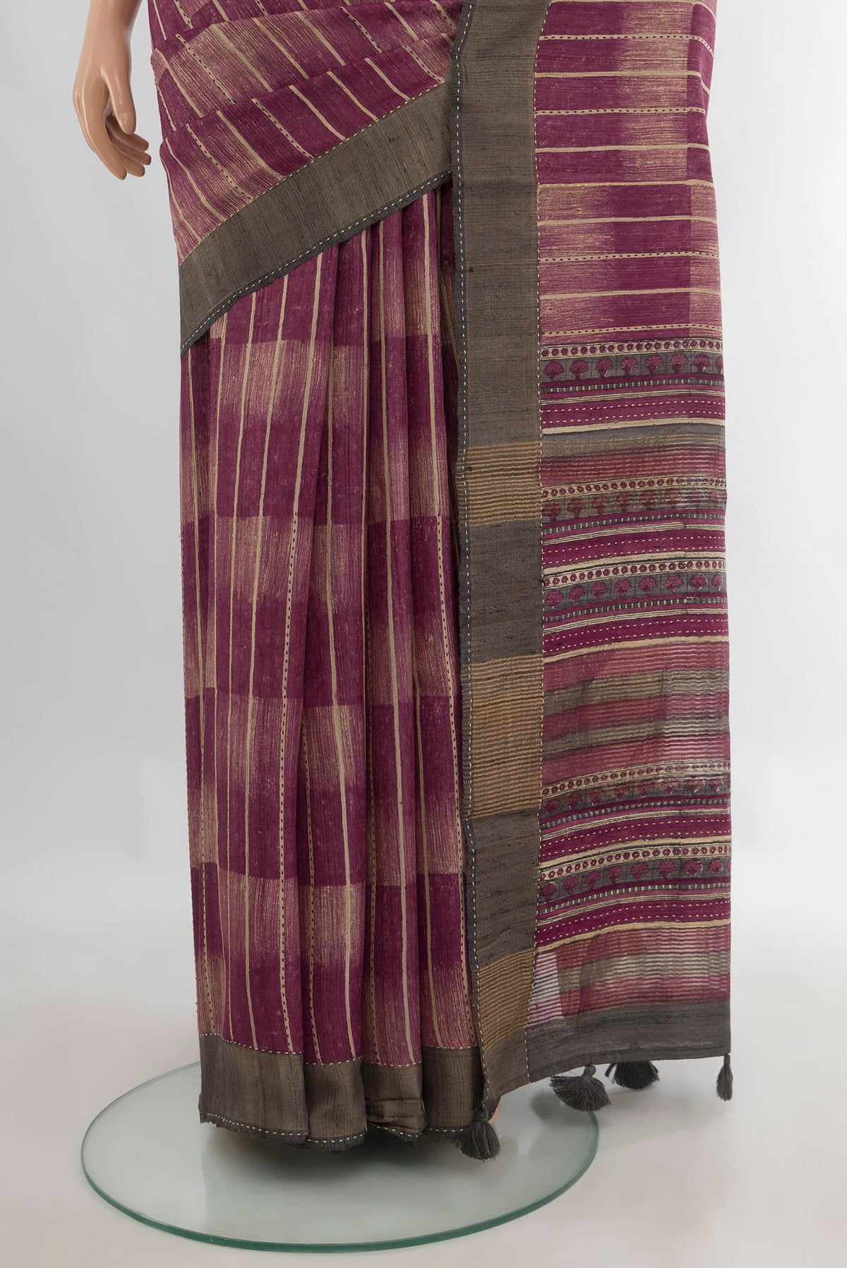 Pleats and pallu of Multi Color Tussar Saree with Printed design on the body and Zari Border. 