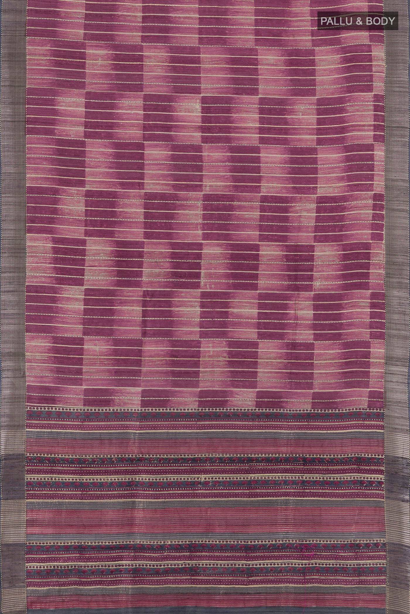 Flat view of Purple Tussar Silk Saree with Printed design on the body and Zari Border. 