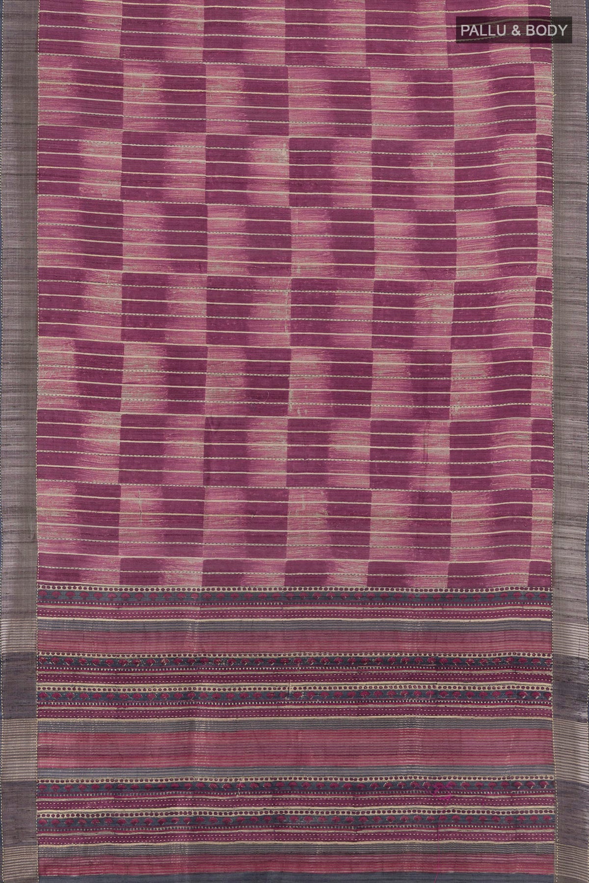 Flat view of Purple Tussar Silk Saree with Printed design on the body and Zari Border. 