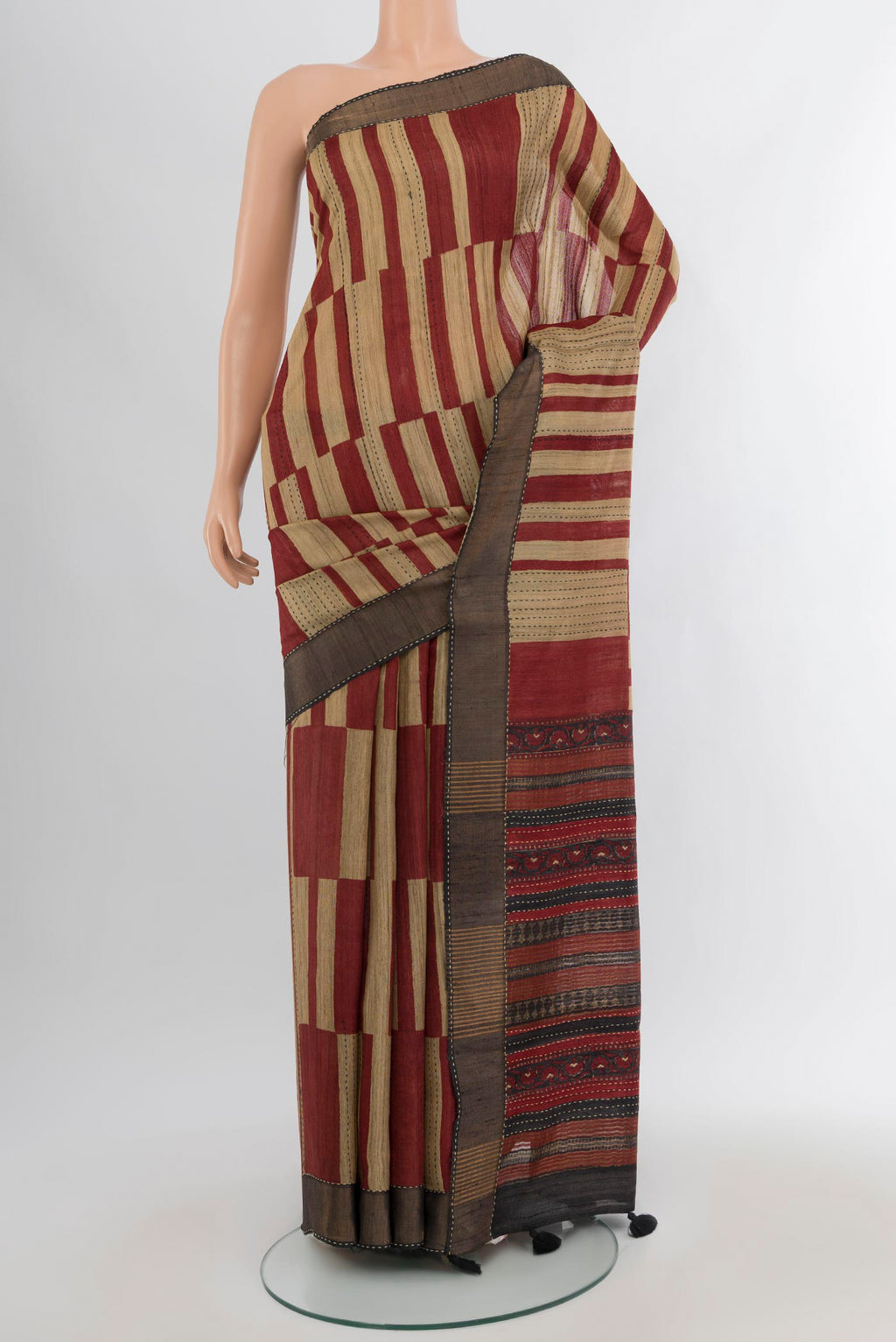 Multi Color Tussar Silk Saree with Printed design on the body and Zari Border.  displayed on a mannequin