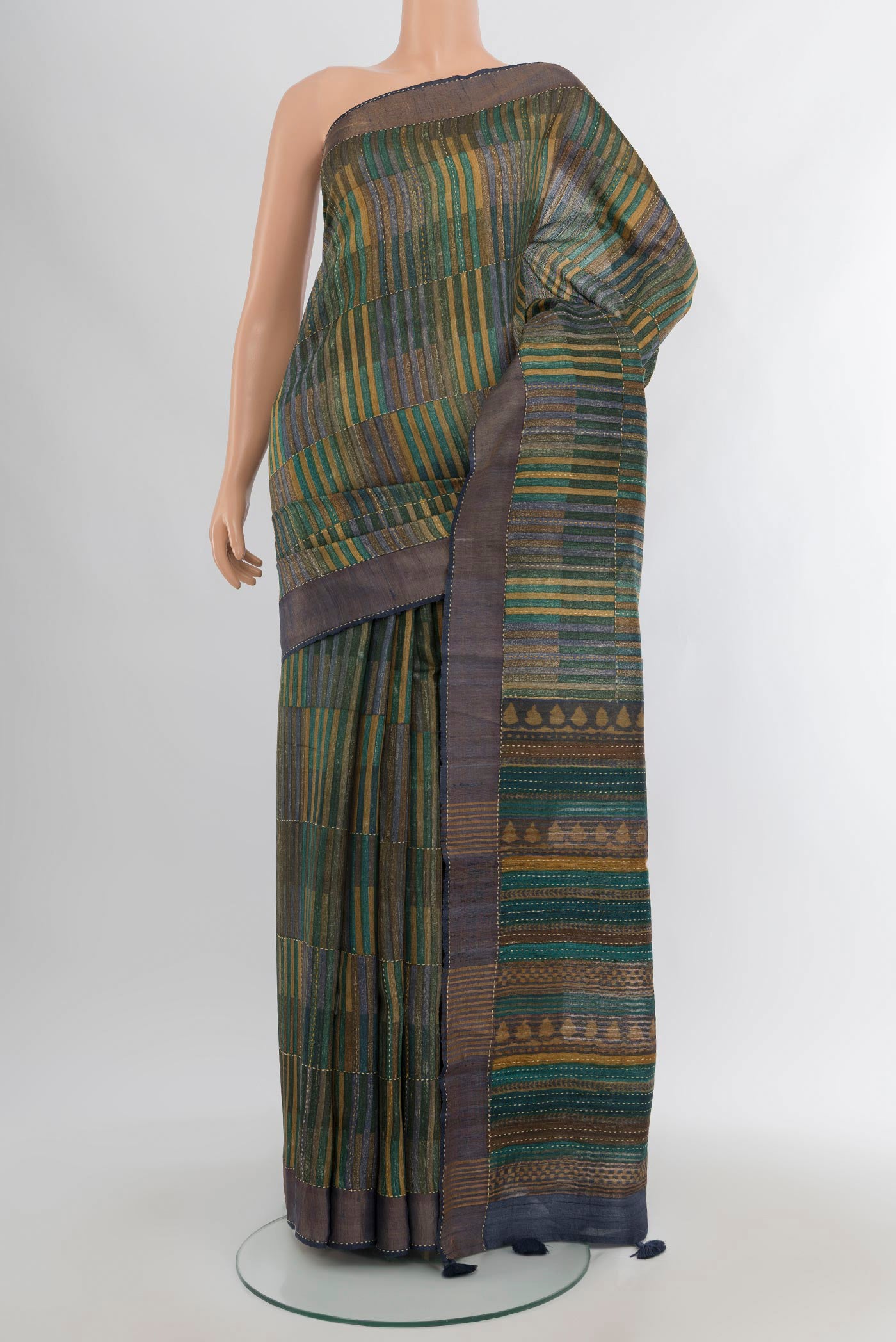 Multi Color Tussar Silk Saree with Geometric Print on the body and Zari Border.  displayed on a mannequin