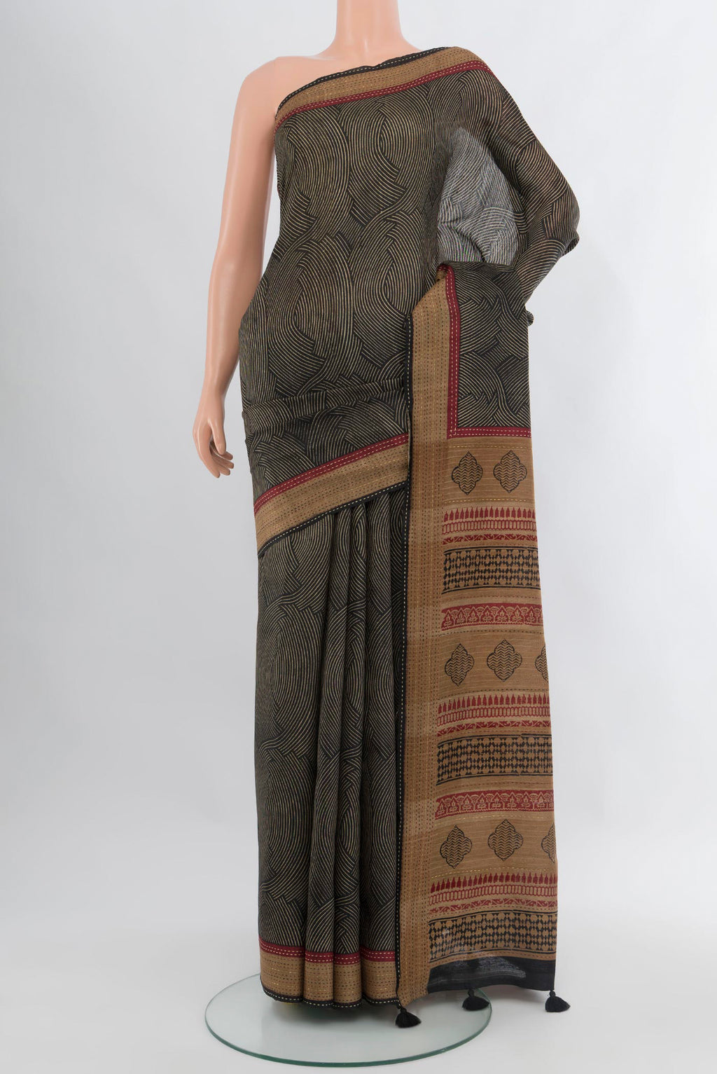 Black Tussar Silk Saree with Printed design on the body and Thread Border.  displayed on a mannequin