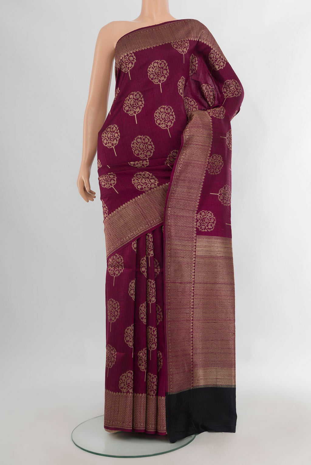Magenta Tussar Saree with Zari Butta on the body and Zari Border.  displayed on a mannequin