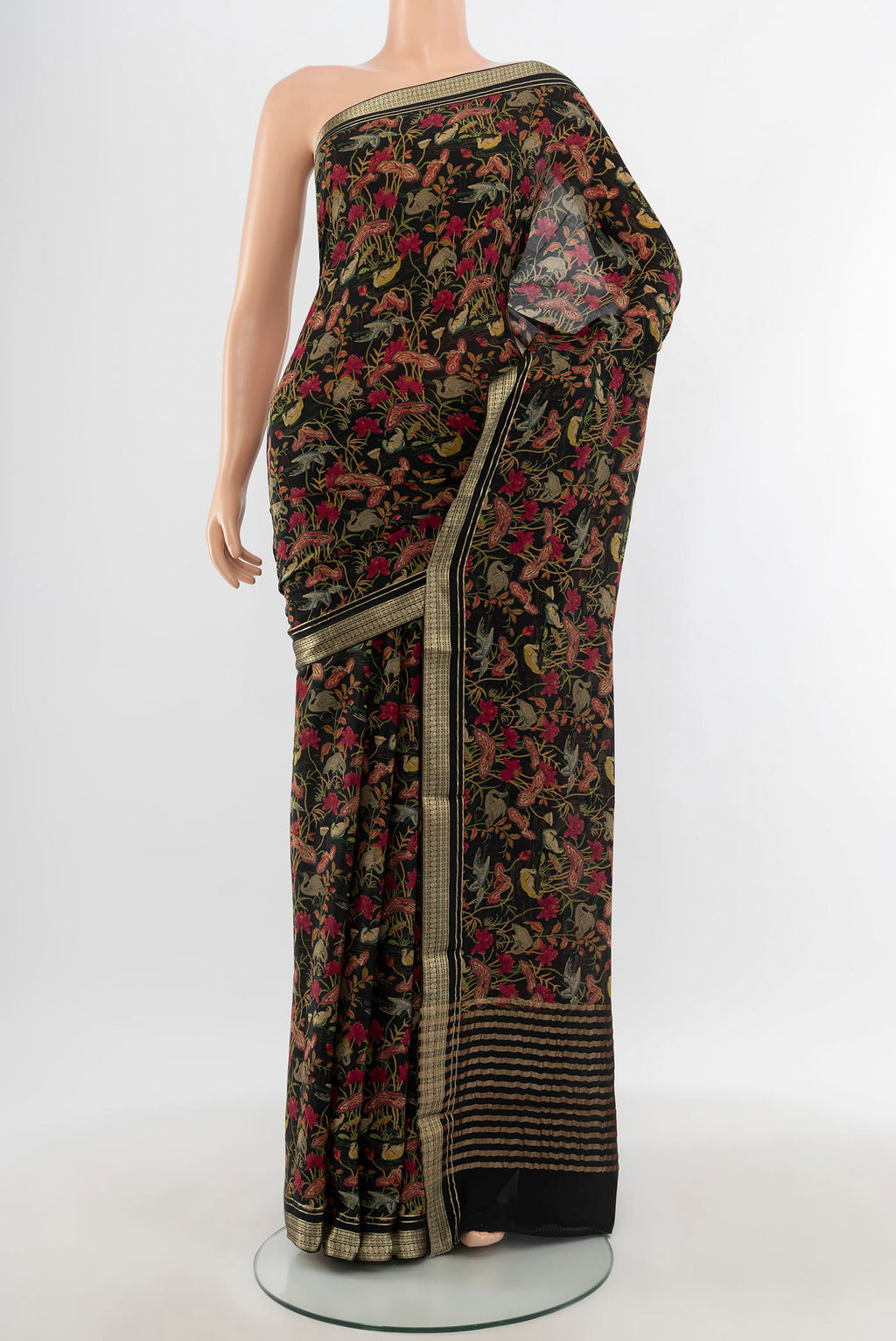 Black Mysore Crepe Saree with Floral Print on the body and Zari Border.  displayed on a mannequin