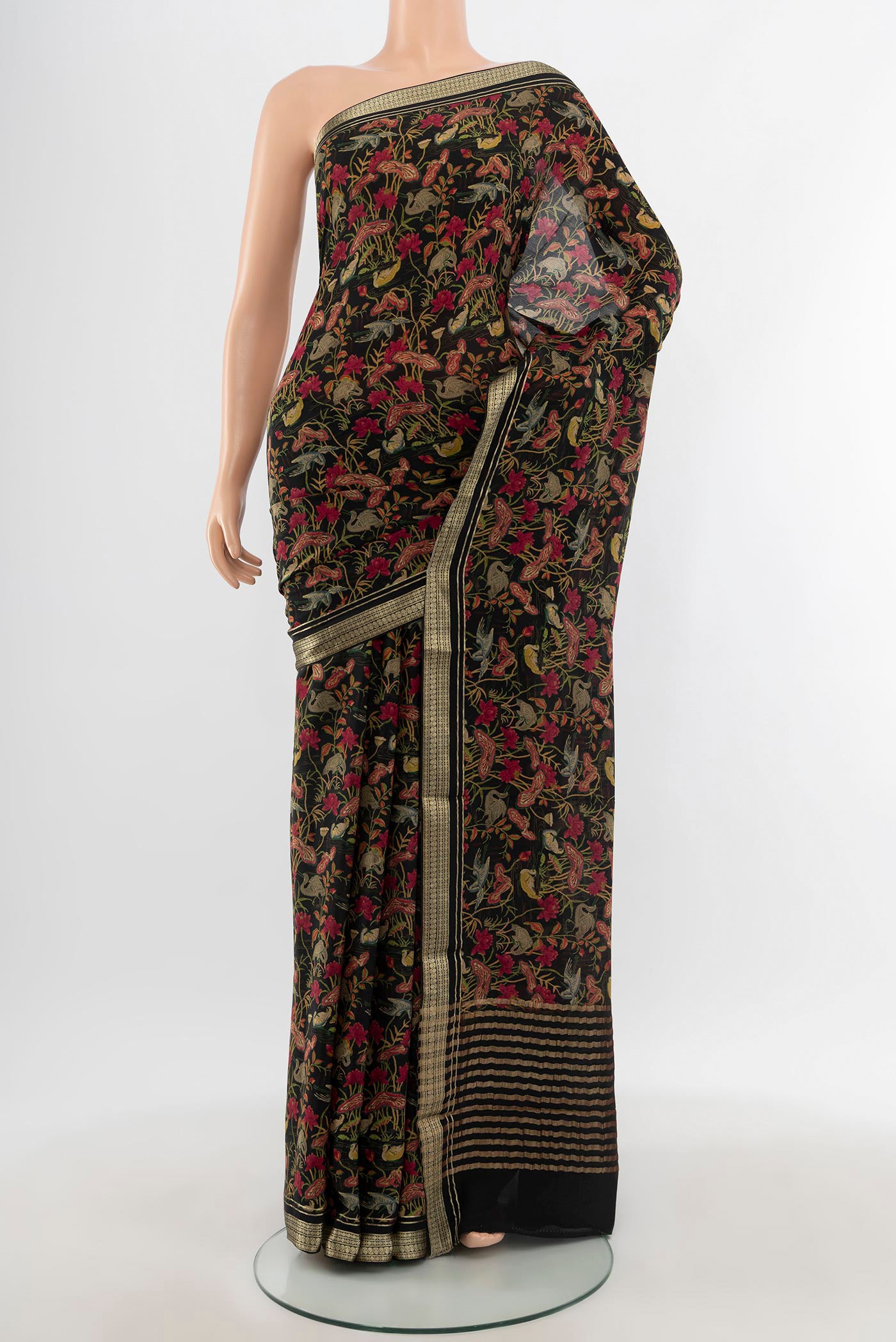 Black Mysore Crepe Saree with Floral Print on the body and Zari Border.  displayed on a mannequin