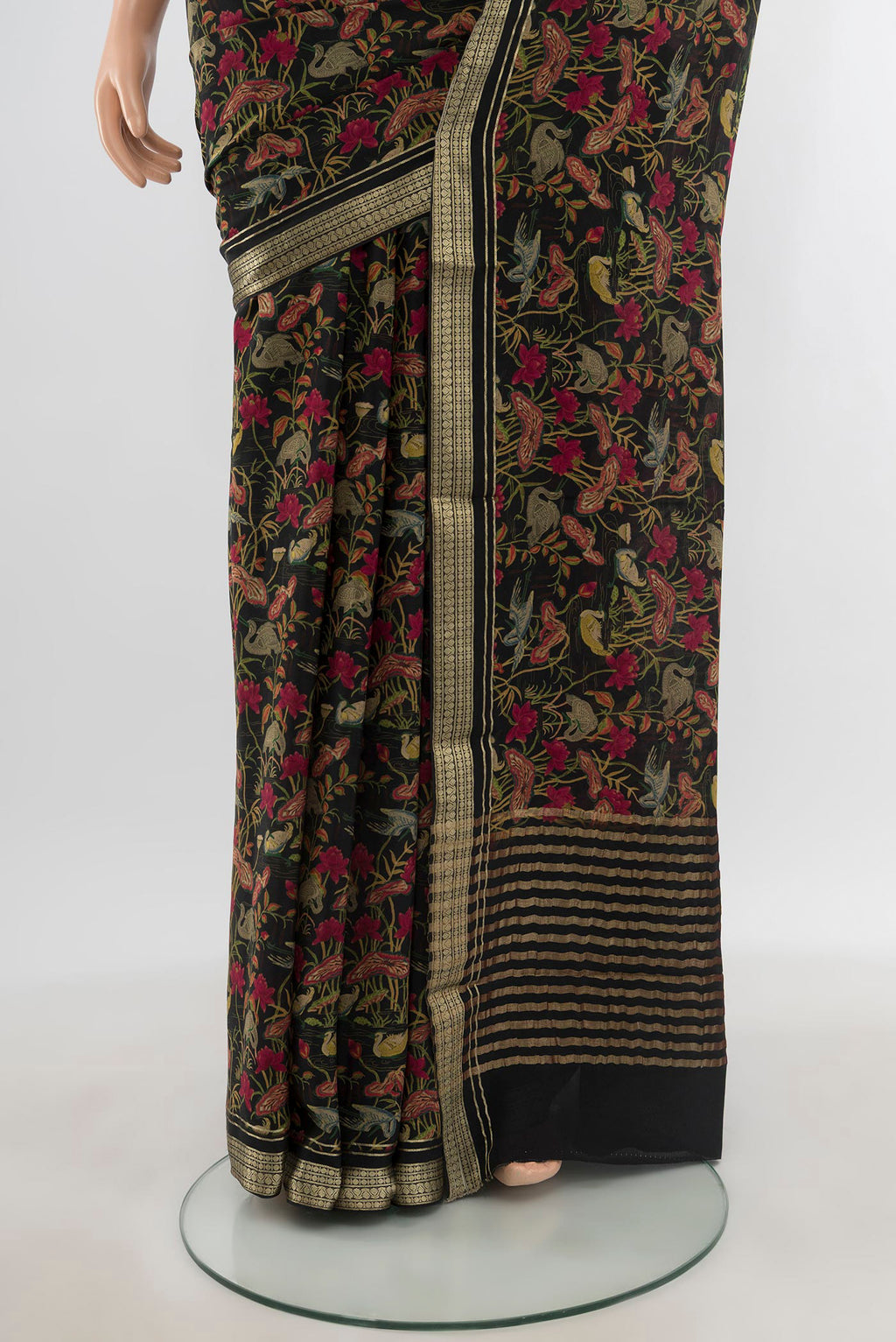 Pleats and pallu of Black Mysore Crepe Saree with Floral Print on the body and Zari Border. 