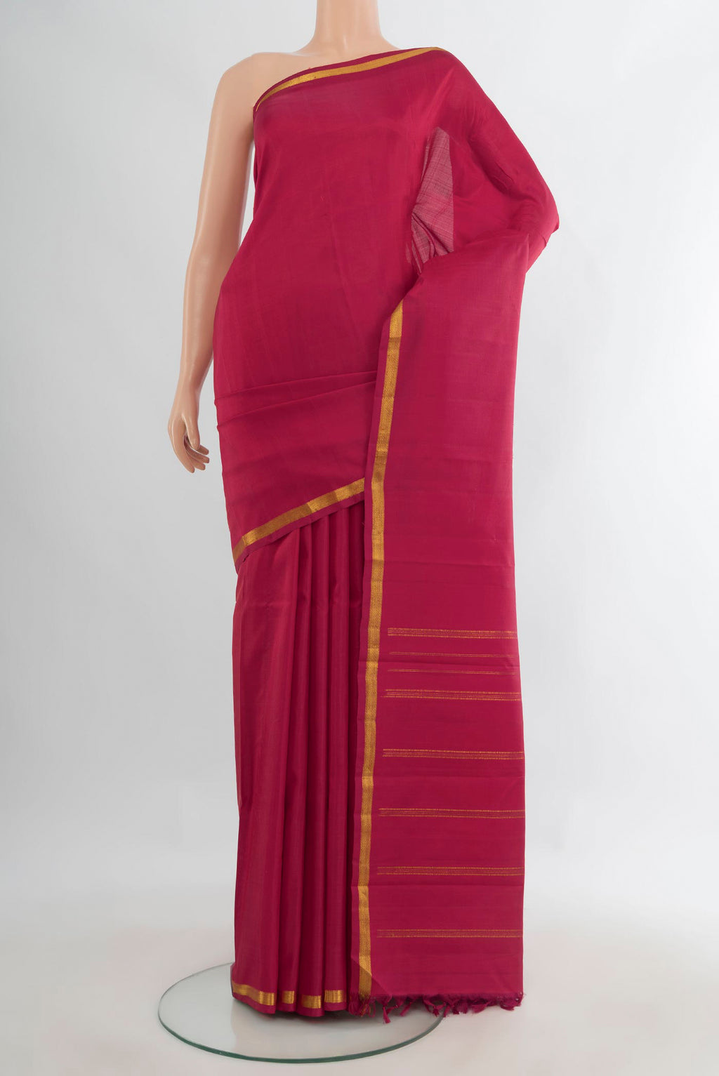 Pure Silk Red Kanjivaram Saree with Plain Body and Silk Border.  displayed on a mannequin