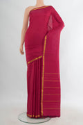 Pure Silk Red Kanjivaram Saree with Plain Body and Silk Border.  displayed on a mannequin