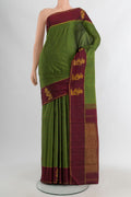 Green Kanchipuram Silk Saree with Stripes on the body and Plain Border.  displayed on a mannequin