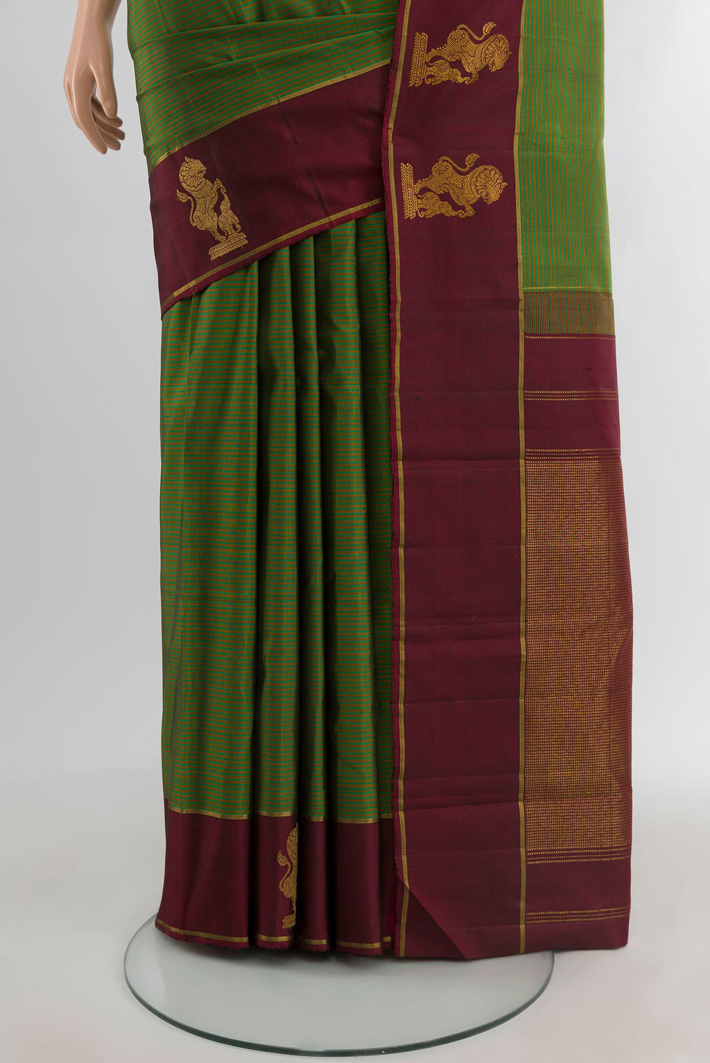 Pleats and pallu of Green Kanchipuram Silk Saree with Stripes on the body and Plain Border. 