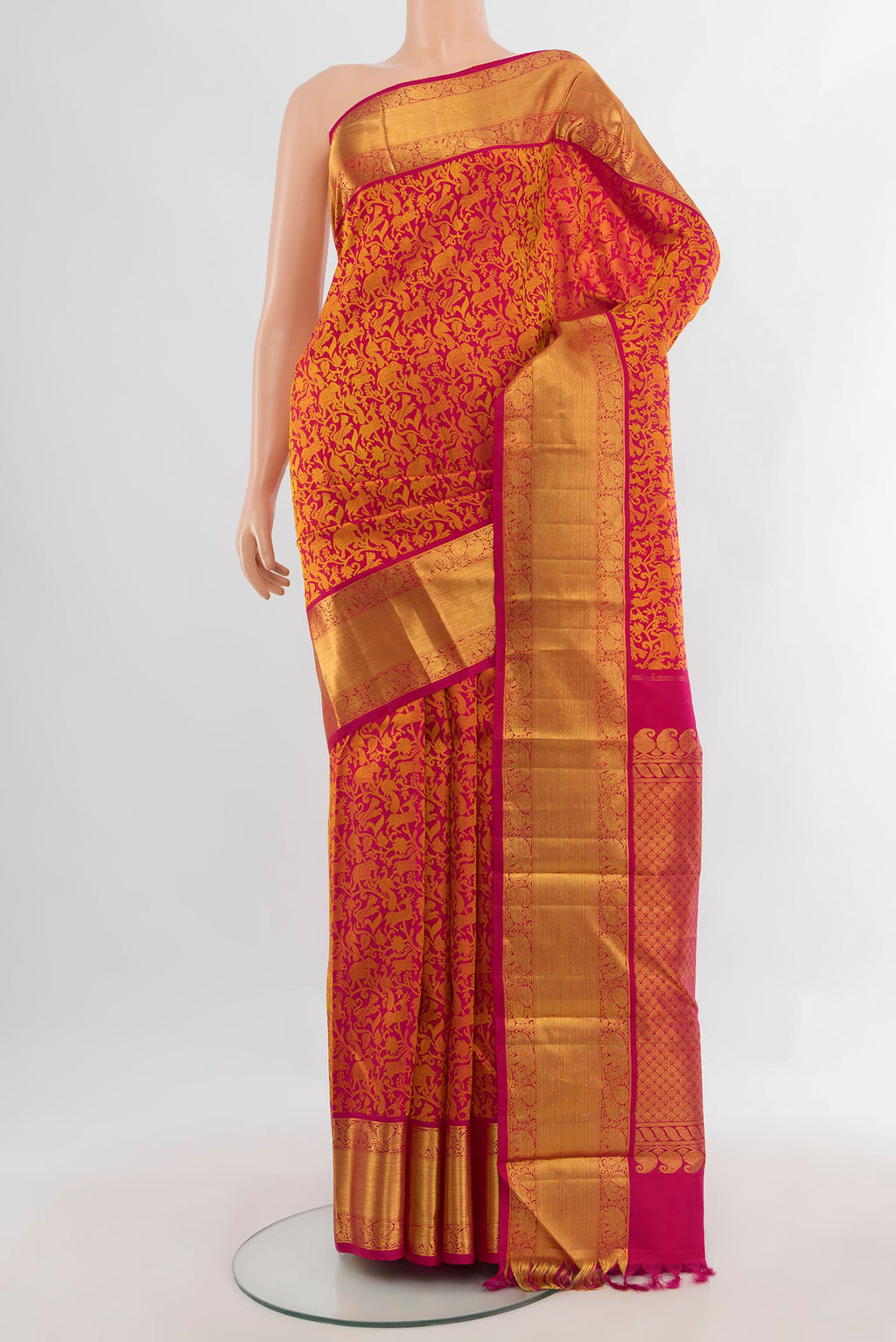 Pure Silk Dark Pink Kanjivaram Saree with Jacquard design on the body and Zari Border.  displayed on a mannequin