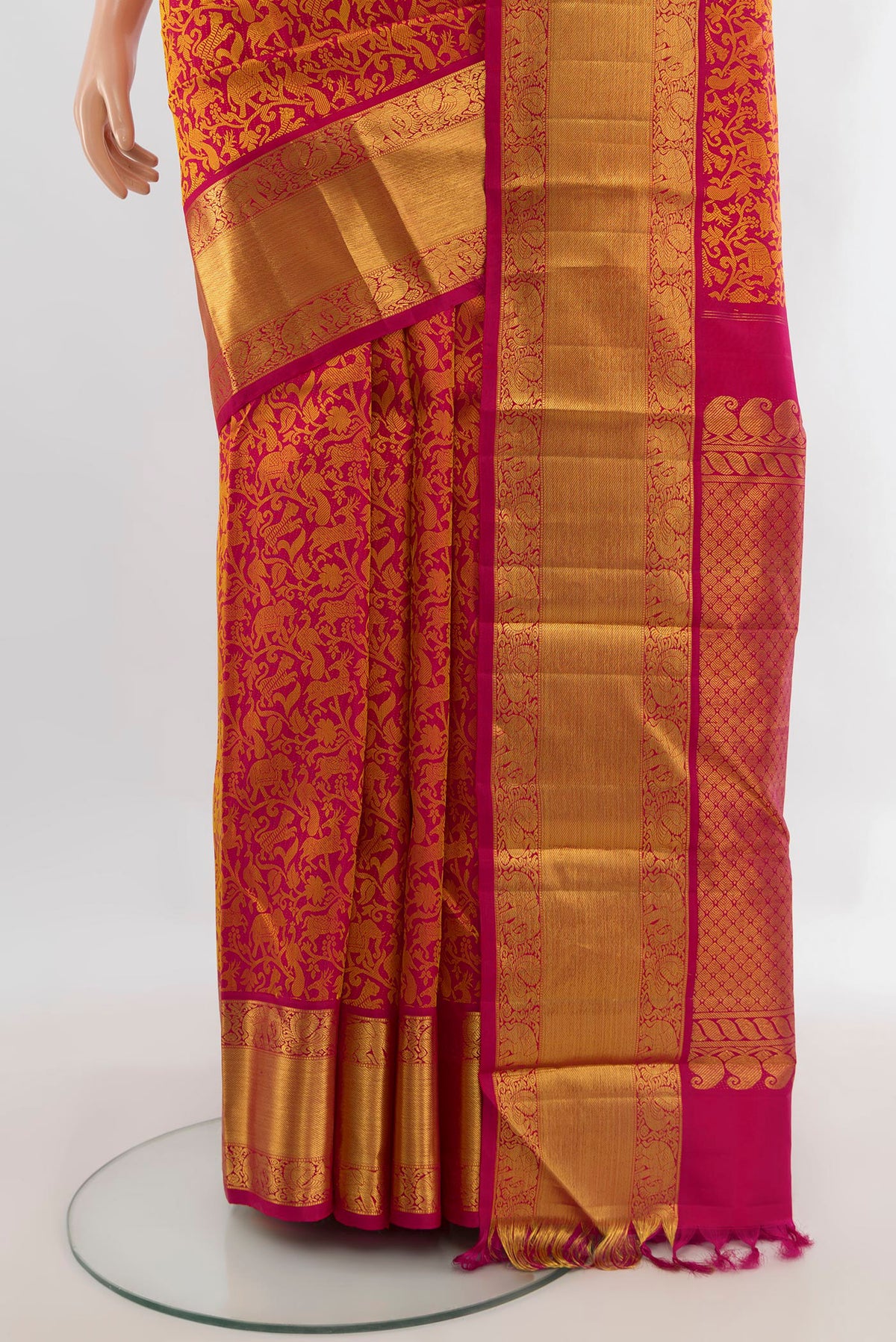Pleats and pallu of Pure Silk Dark Pink Kanjivaram Saree with Jacquard design on the body and Zari Border. 