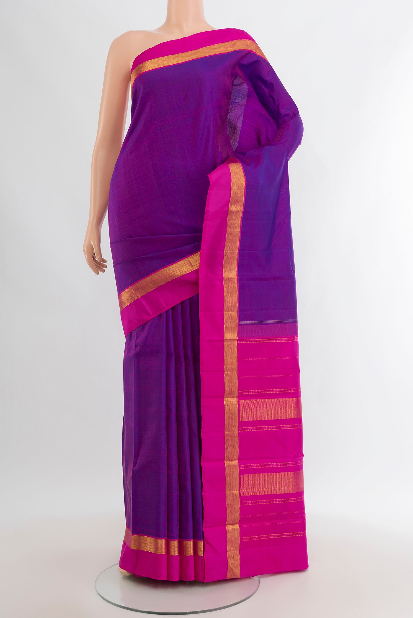 Purple Kanjivaram Silk Saree with Plain Body and Zari Border.  displayed on a mannequin