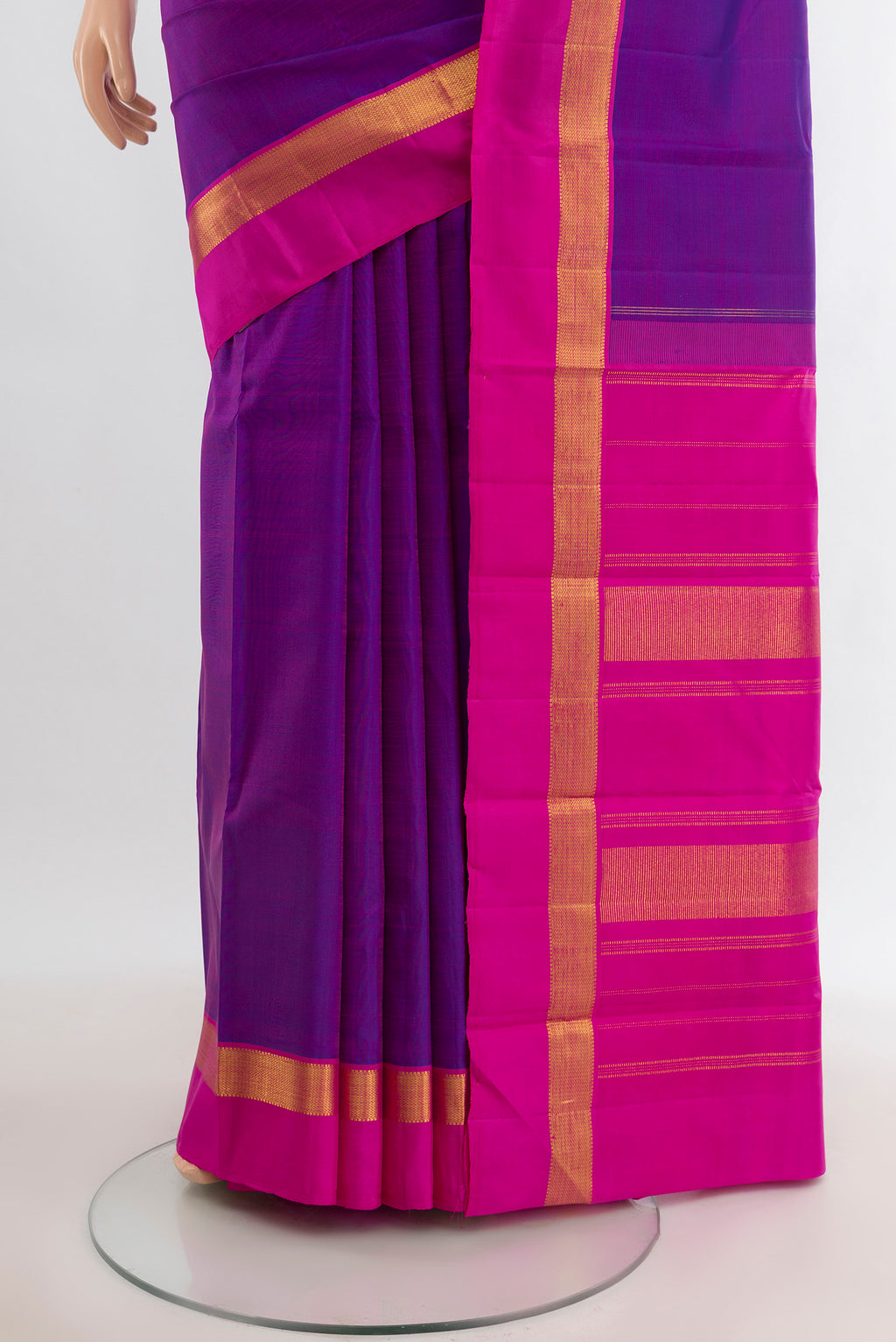 Pleats and pallu of Purple Kanjivaram Silk Saree with Plain Body and Zari Border. 
