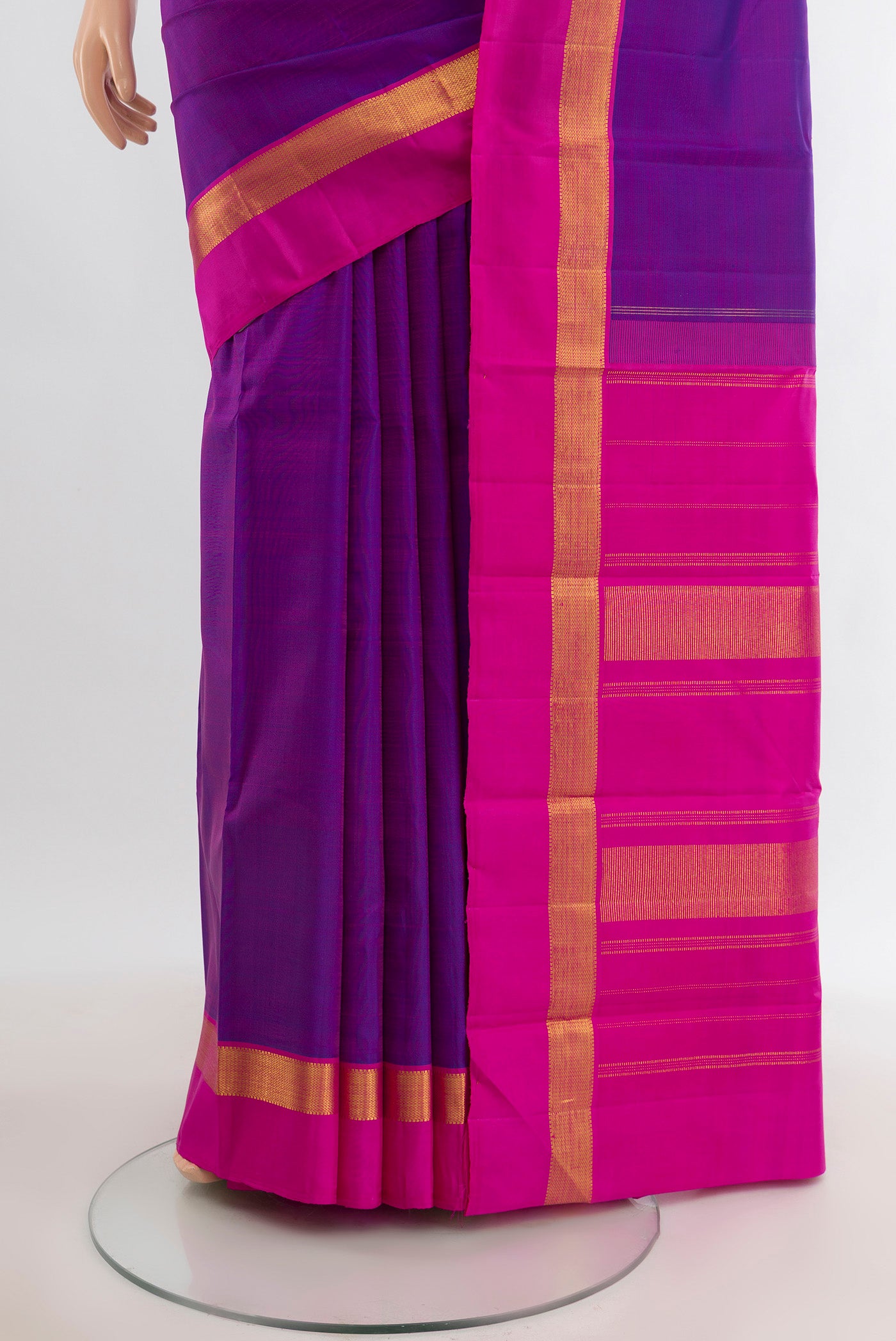 Pleats and pallu of Purple Kanjivaram Silk Saree with Plain Body and Zari Border. 