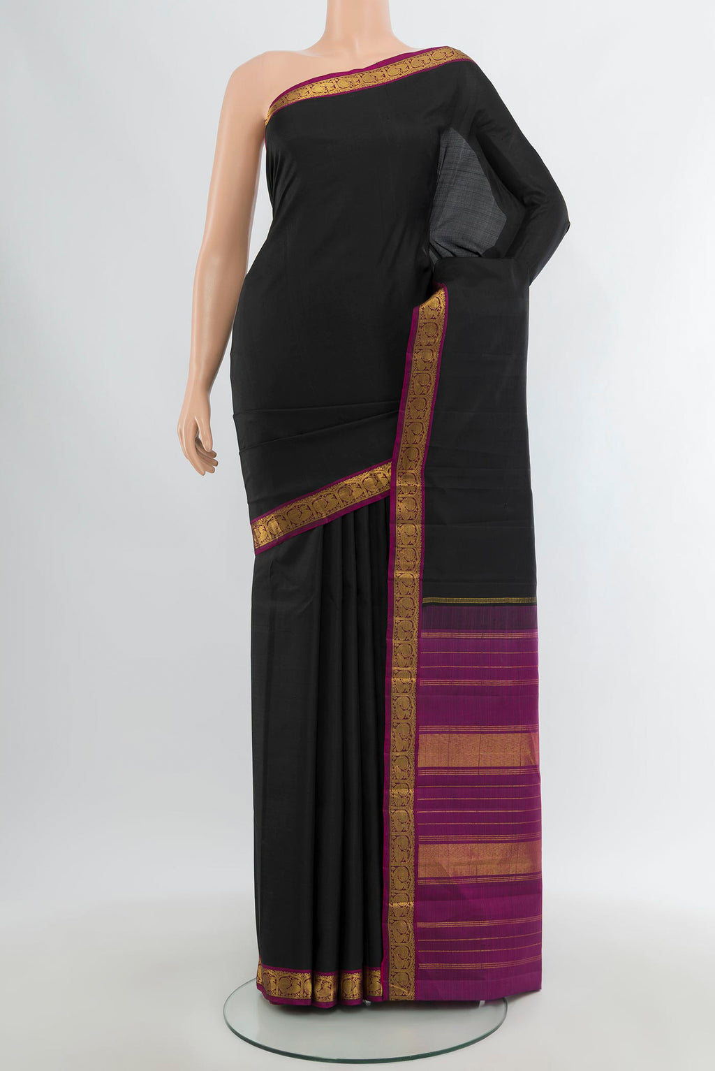 Black Kanjivaram Silk Saree with Plain Body and Zari Border.  displayed on a mannequin