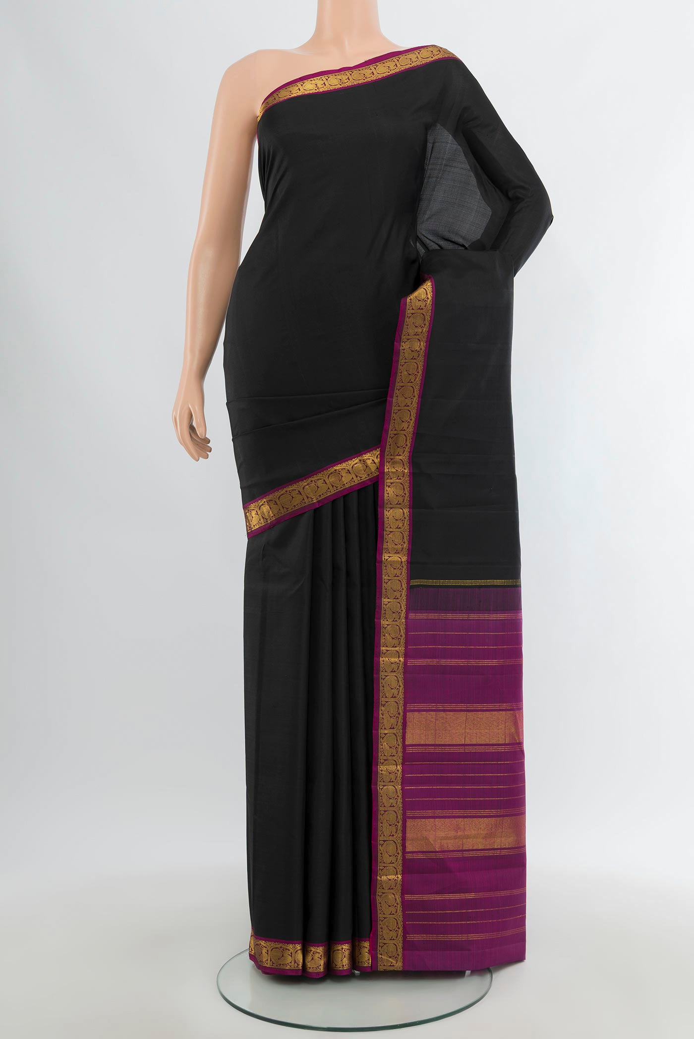 Black Kanjivaram Silk Saree with Plain Body and Zari Border.  displayed on a mannequin
