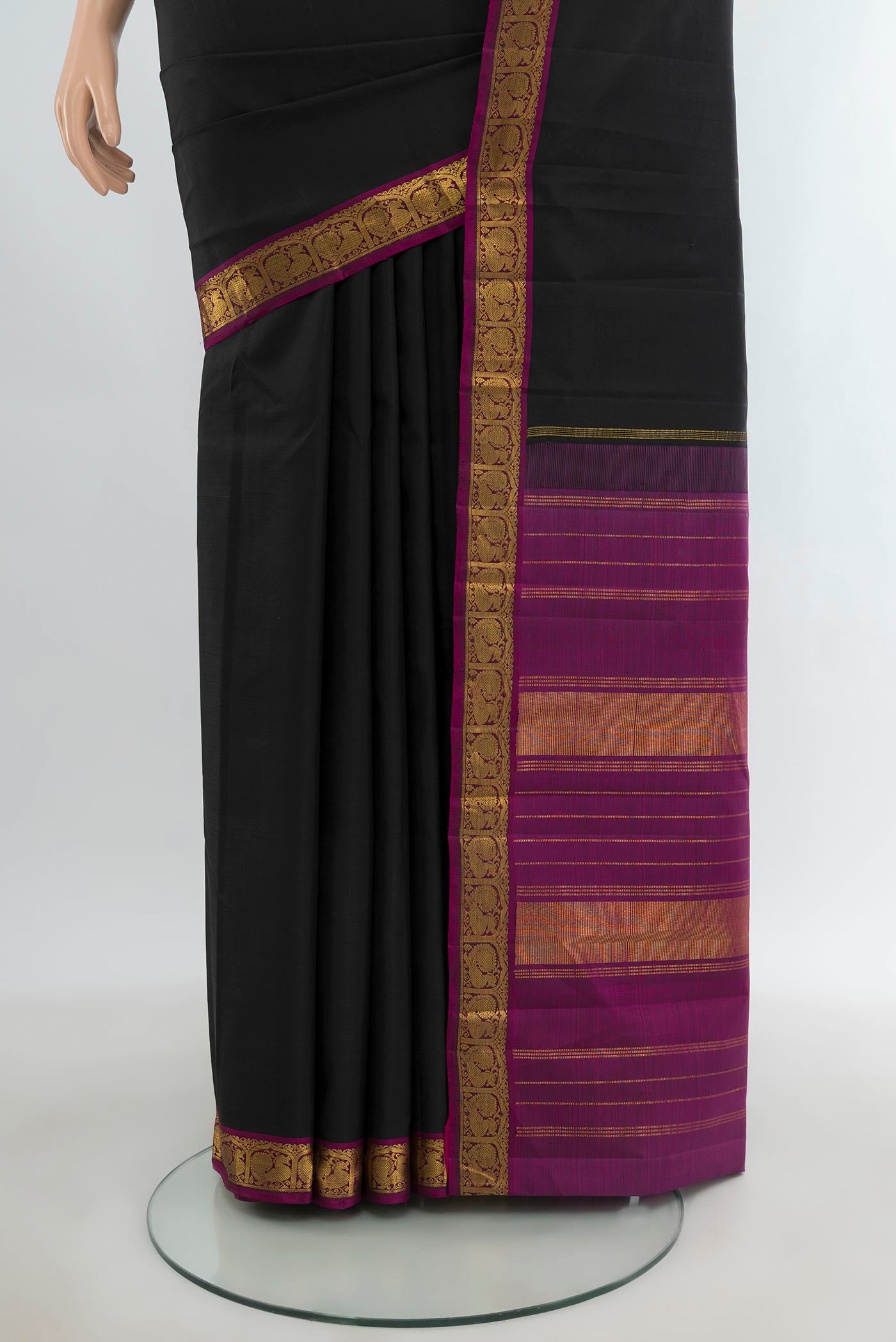 Pleats and pallu of Black Kanjivaram Silk Saree with Plain Body and Zari Border. 