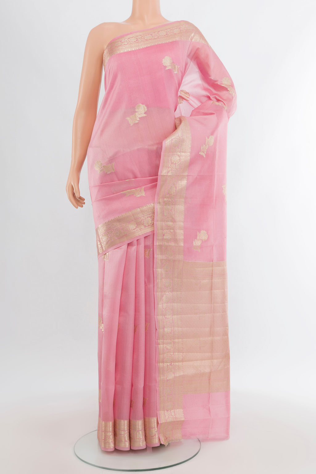 Rose pink Banarasi Raw Silk Saree with Zari Butta on the body and Zari Border.  displayed on a mannequin