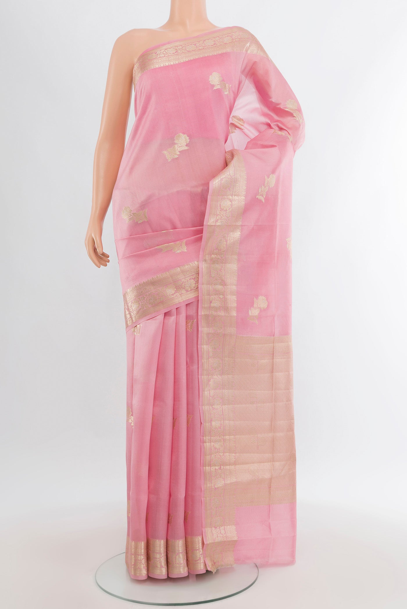 Rose pink Banarasi Raw Silk Saree with Zari Butta on the body and Zari Border.  displayed on a mannequin