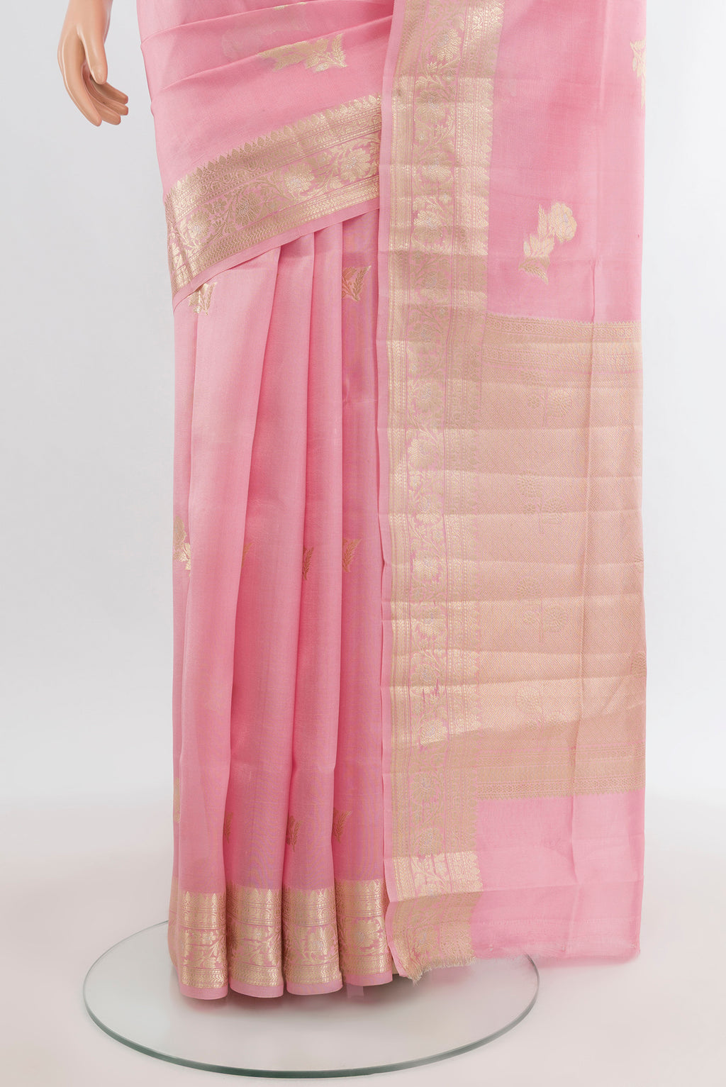 Pleats and pallu of Rose pink Banarasi Raw Silk Saree with Zari Butta on the body and Zari Border. 