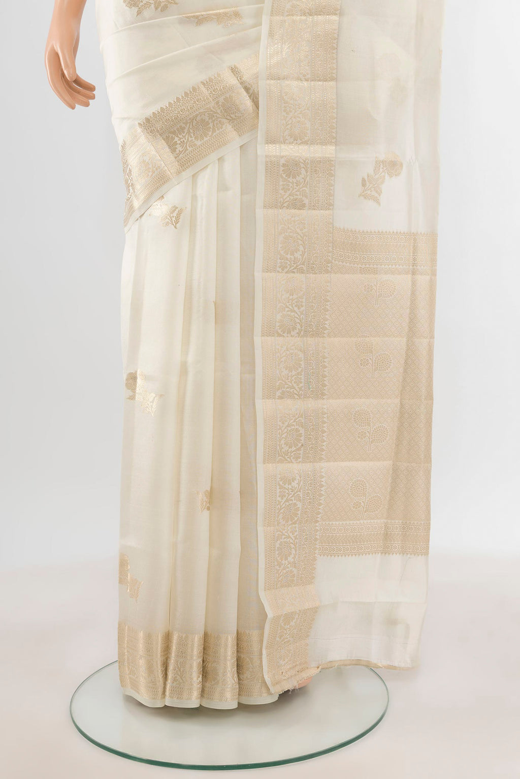 Pleats and pallu of White Banarasi Raw Silk Saree with Zari Butta on the body and Zari Border. 